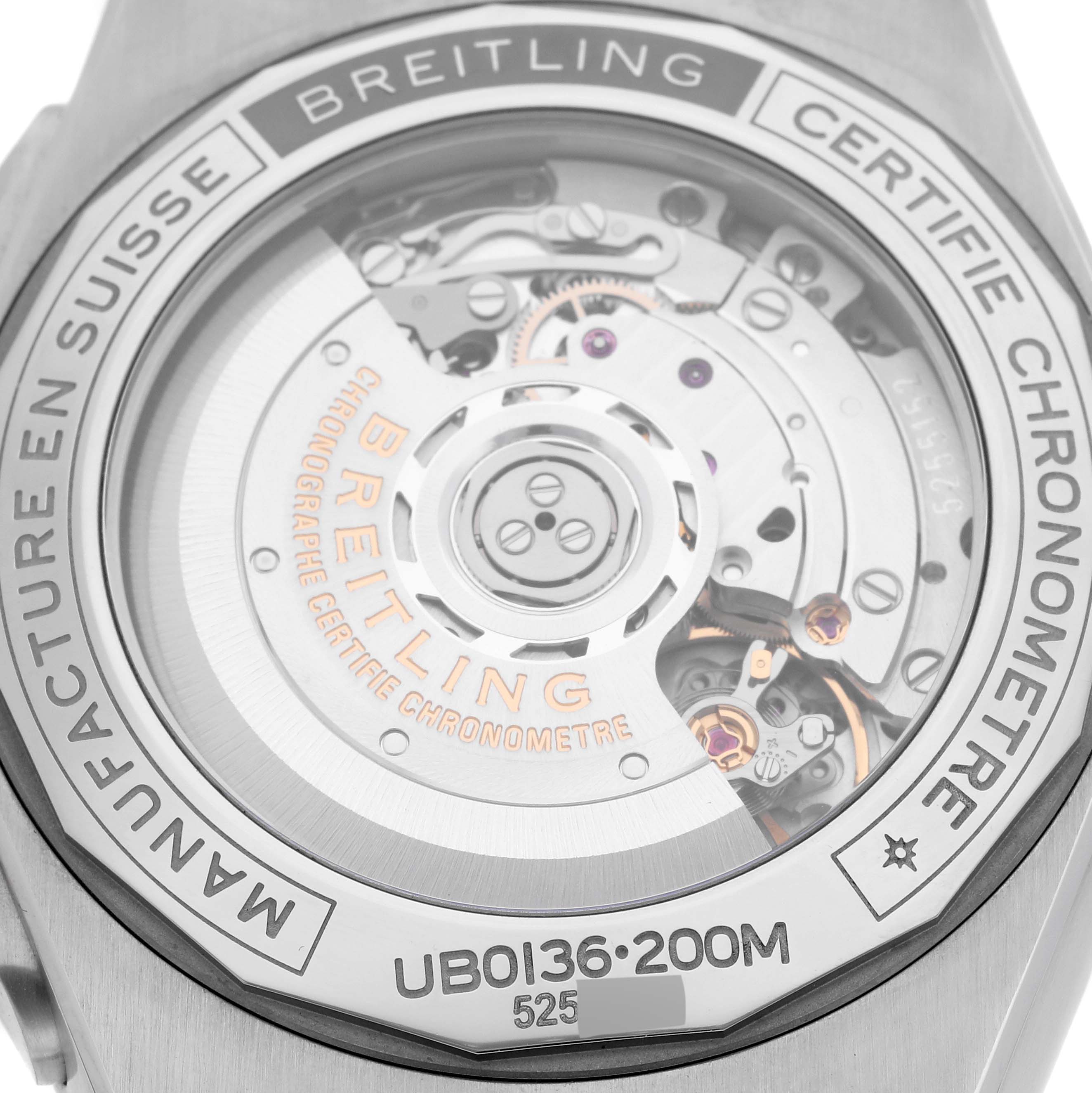 The image shows the back view of a Breitling Chronomat UB0136251L1S1 Men's Steel and Gold (two tone) Green Dial UB0136251L1S1 Men's Steel and Gold (two tone) Green Dial watch, highlighting the internal movement mechanism.