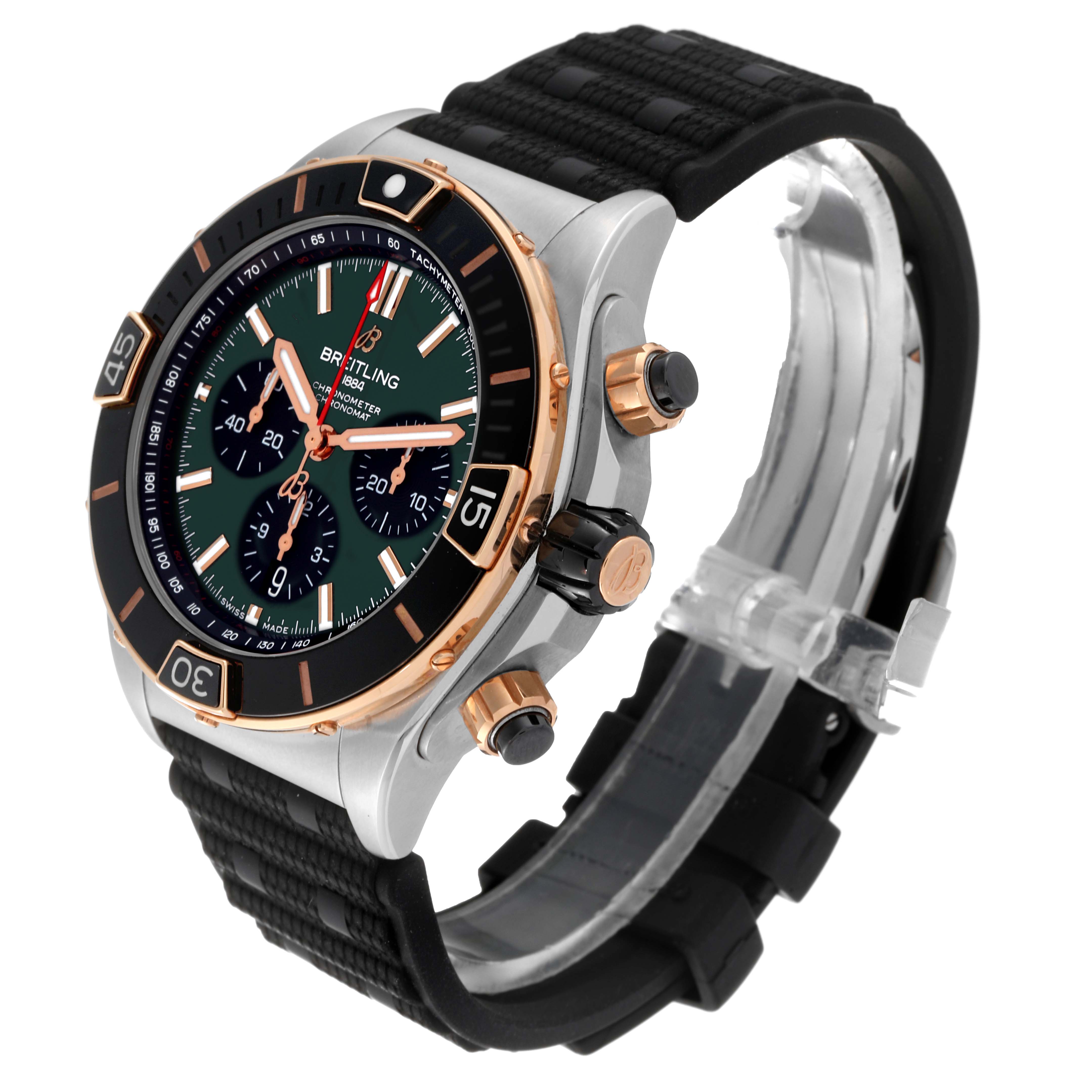 The image shows a Breitling Chronomat UB0136251L1S1 Men's Steel and Gold (two tone) Green Dial UB0136251L1S1 Men's Steel and Gold (two tone) Green Dial watch at an angle revealing its dial, bezel, strap, crown, and push buttons.