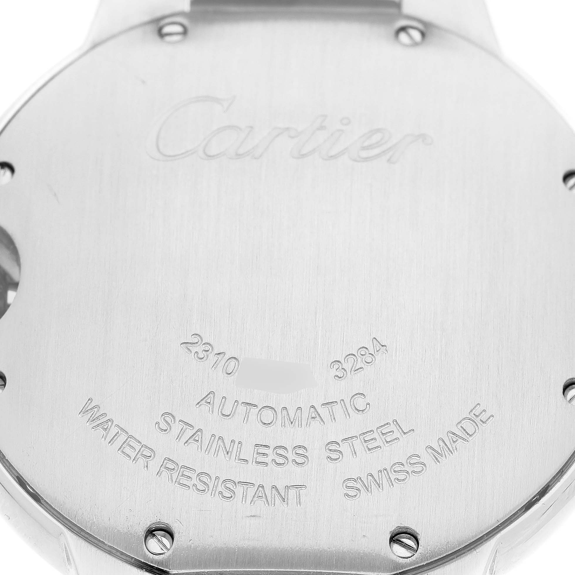 The image shows the back of a Cartier Ballon Bleu W6920046 Women's Stainless Steel Silver Dial watch displaying engraved details about the model and materials.