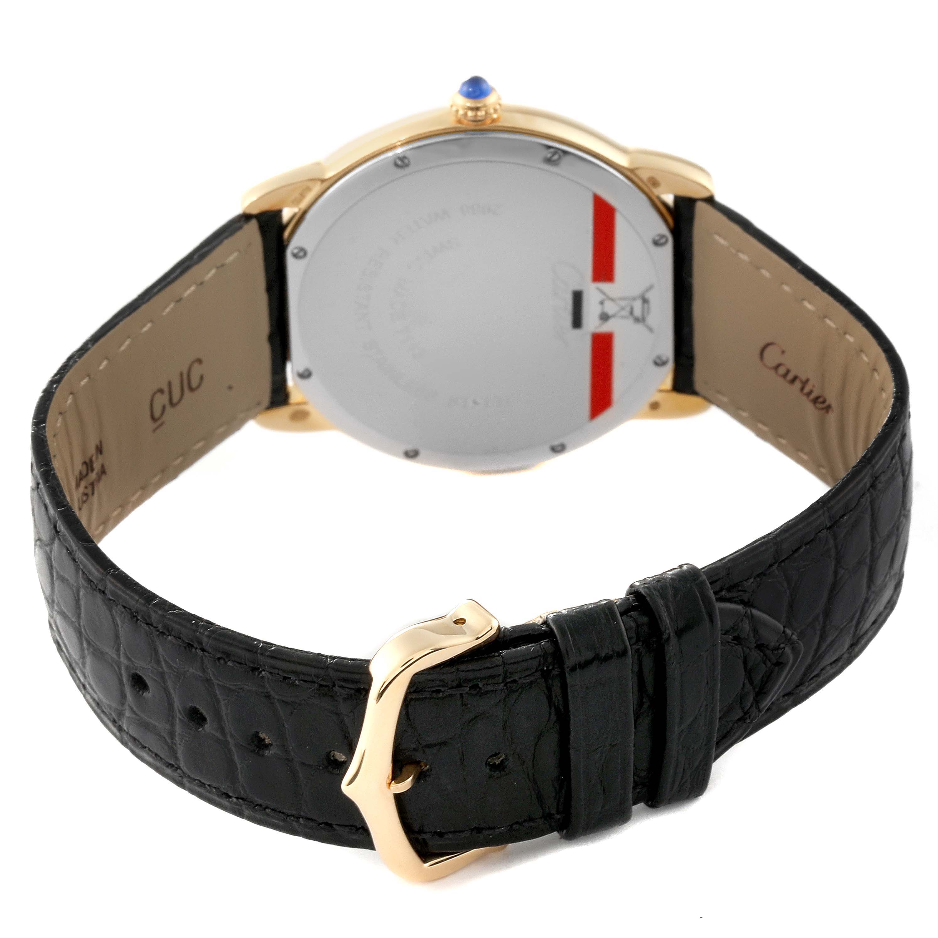 This image shows the backside and strap of a Ronde model by Cartier, including the gold buckle and black leather band.