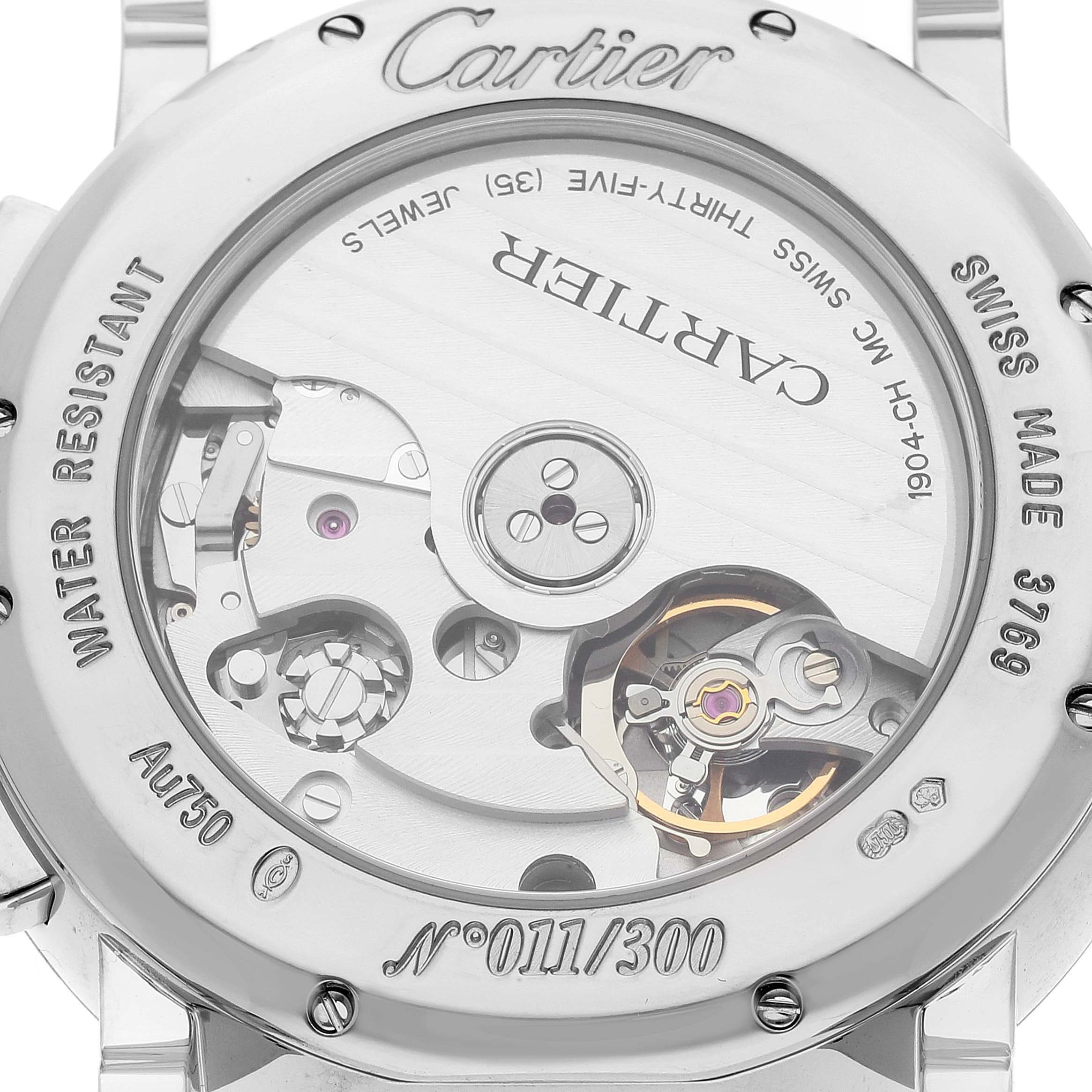 The image shows the back case of a Rotonde model by Cartier, revealing its mechanical inner workings and serial number 011/300.