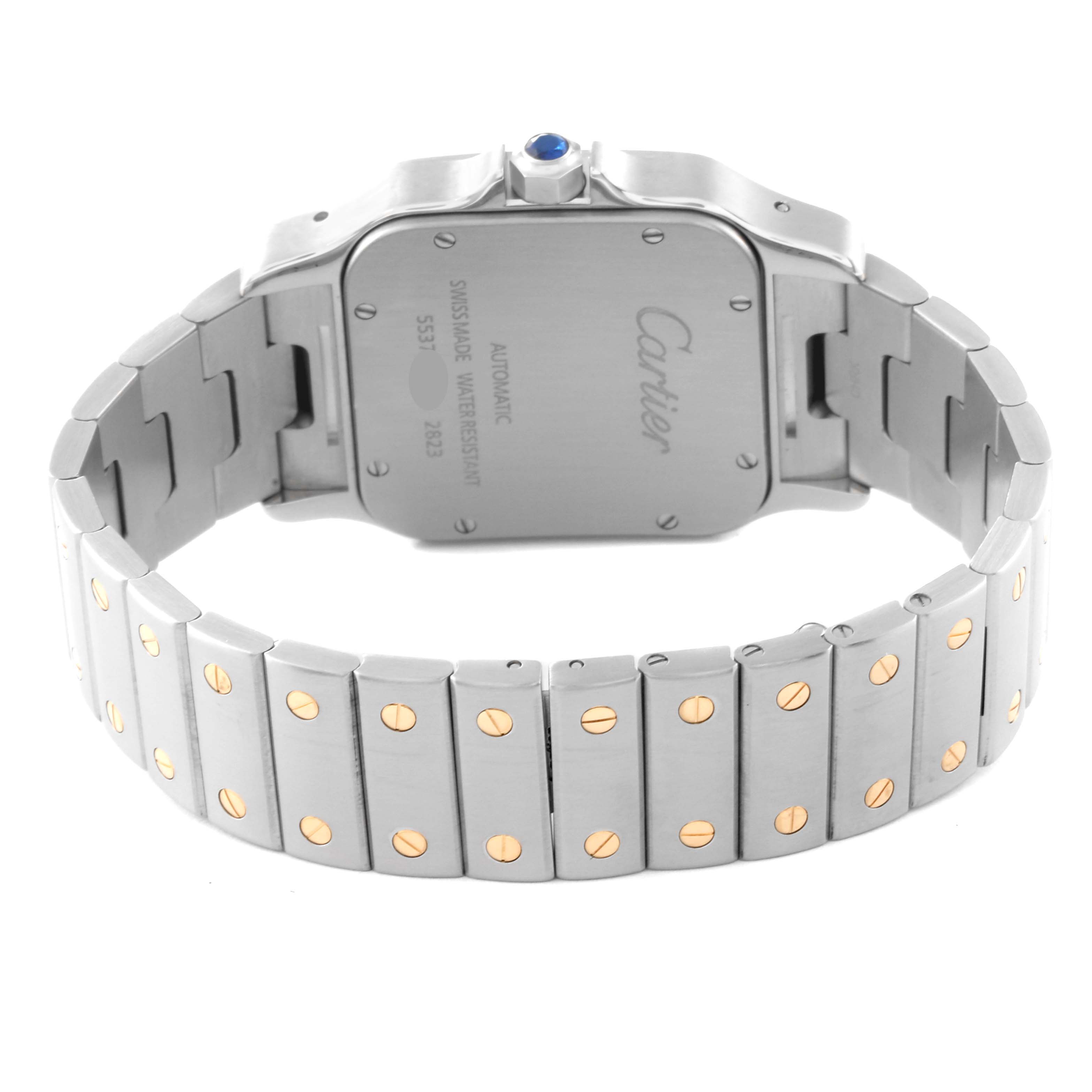 The image shows the backside and bracelet of the Cartier Santos W20099C4 Men's Steel and Gold (two tone) Silver Dial W20099C4 Men's Steel and Gold (two tone) Silver Dial watch, highlighting the case back and metal links with gold screws.