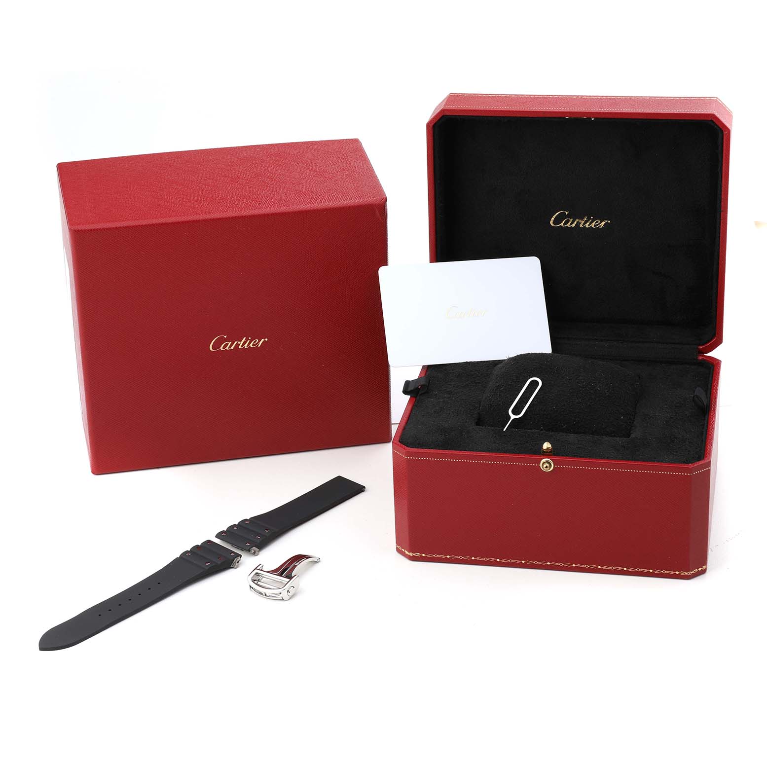 The image shows a Cartier Santos WSSA0078 Men's Stainless Steel Grey Dial watch case, extra strap, and watch face at an angle displaying the accessories and packaging.