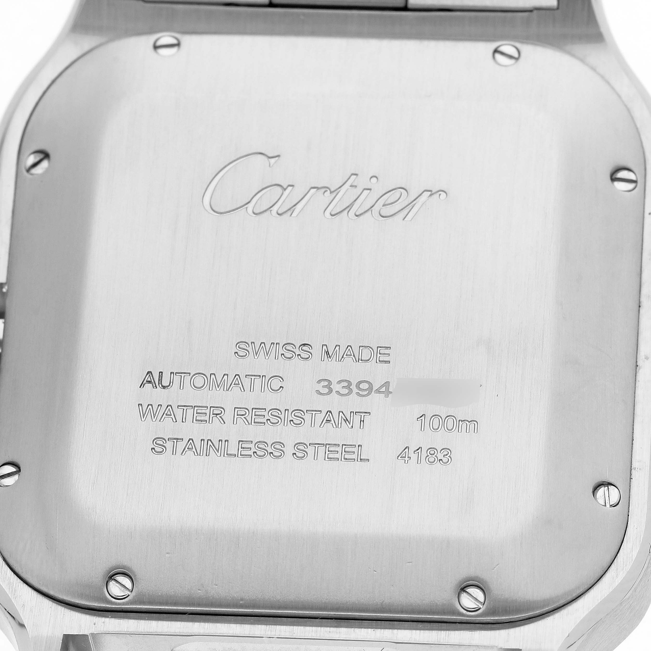 The image shows the back case of a Cartier Santos WSSA0078 Men's Stainless Steel Grey Dial watch, highlighting details like "Swiss Made" and water resistance.