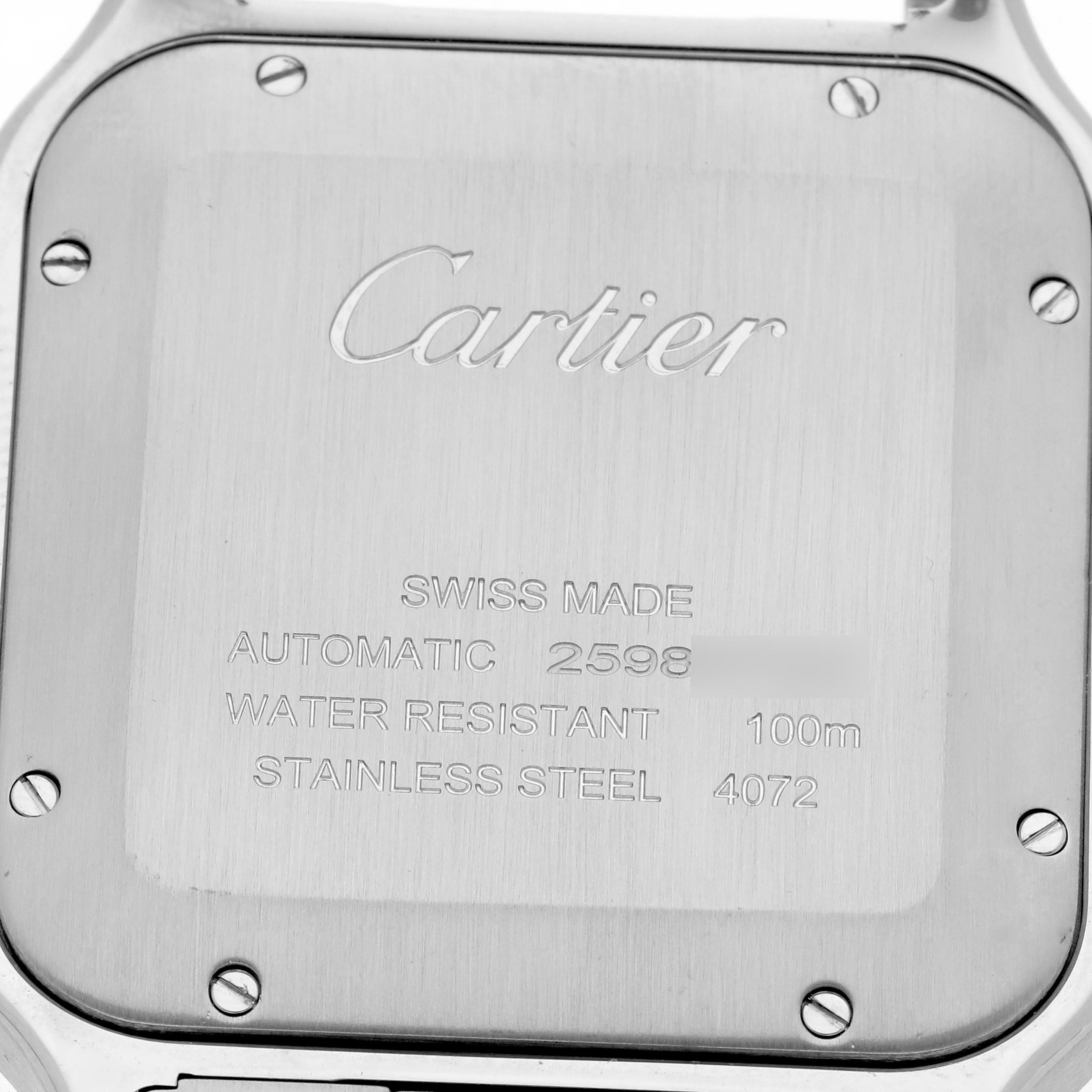 The image shows the case back of a Cartier Santos WSSA0018 Men's Stainless Steel Silver Dial WSSA0018 Men's Stainless Steel Silver Dial watch, featuring engravings and screws from a direct angle.