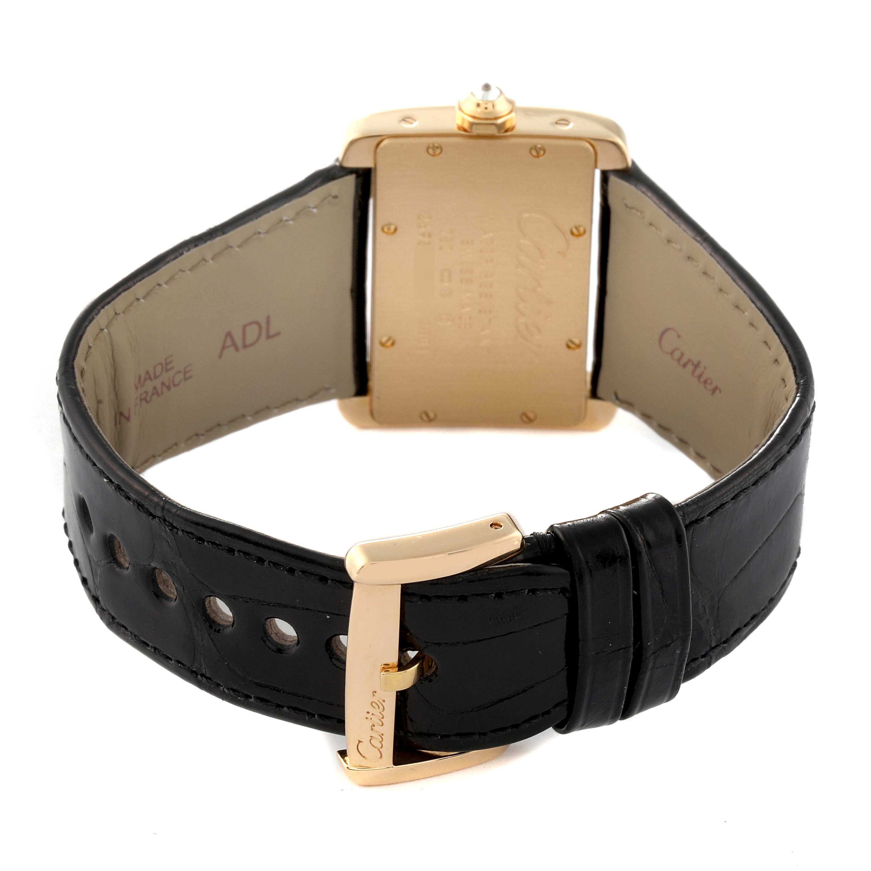 The image shows the back view of a Cartier Tank Divan WA301036 Women's Yellow Gold Silver Dial WA301036 Women's Yellow Gold Silver Dial watch, highlighting the case back, gold buckle, and black leather strap.