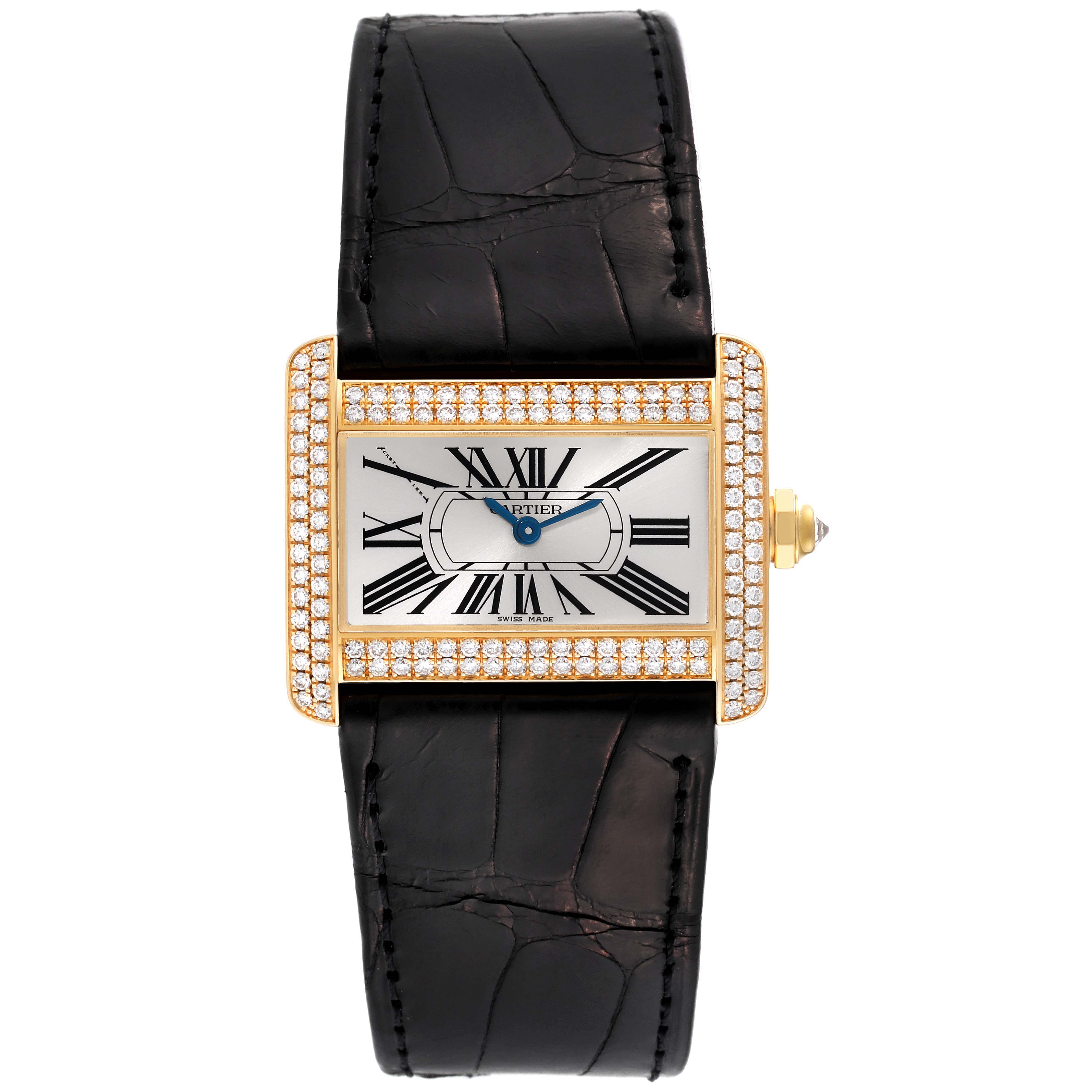 The Tank Divan model by Cartier is shown from a top-down angle, featuring its face, bezel, and strap.