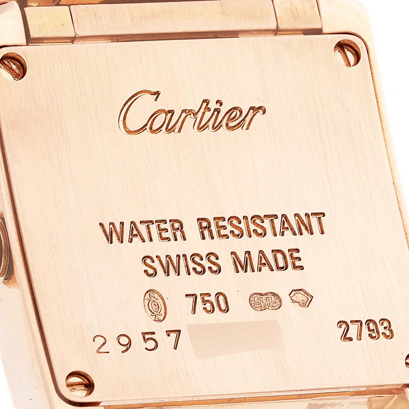 The image shows the back case of a Cartier Tank Française watch with engravings indicating water resistance and Swiss made.
