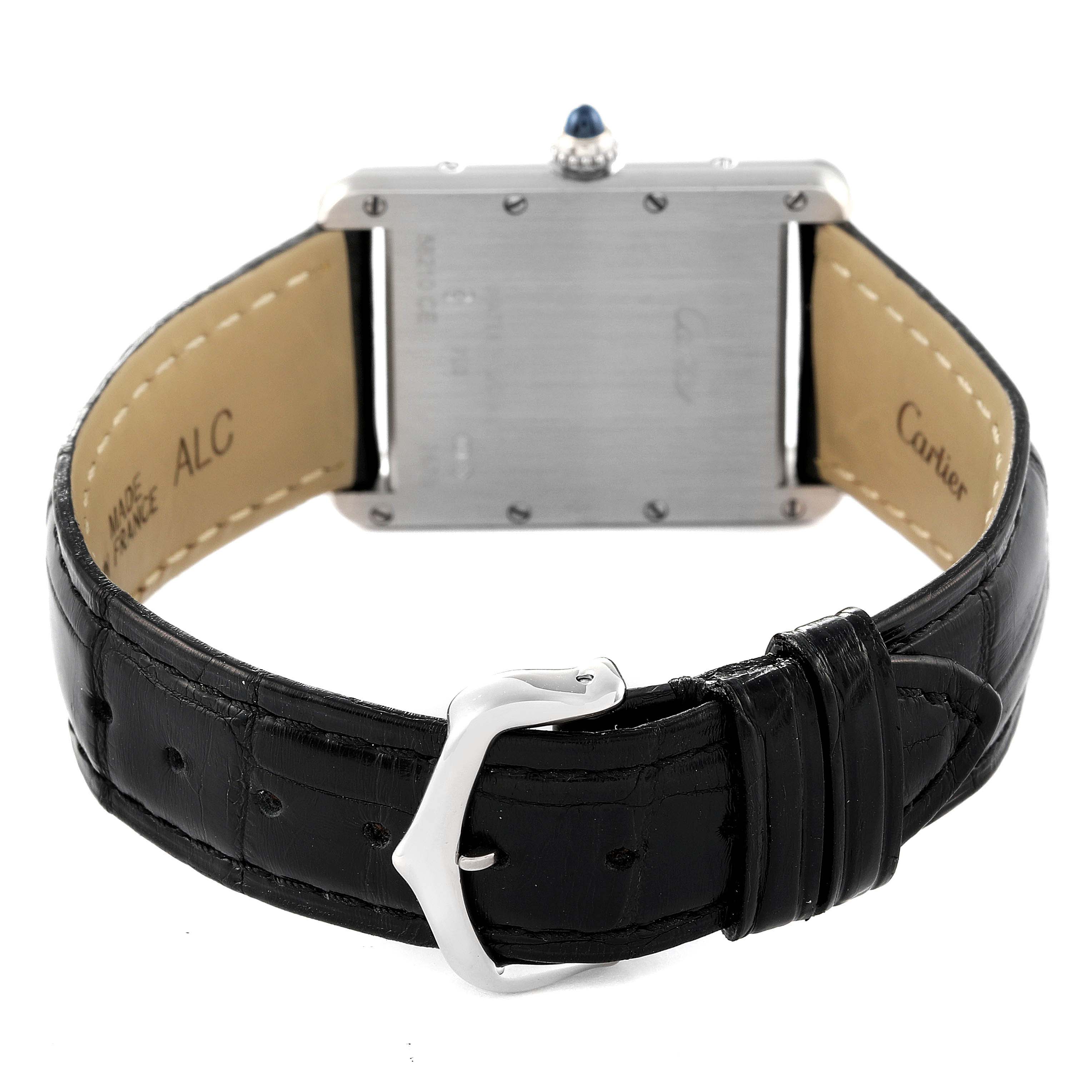 This image shows the back view of a Tank Louis watch by Cartier, highlighting the black leather strap and clasp.