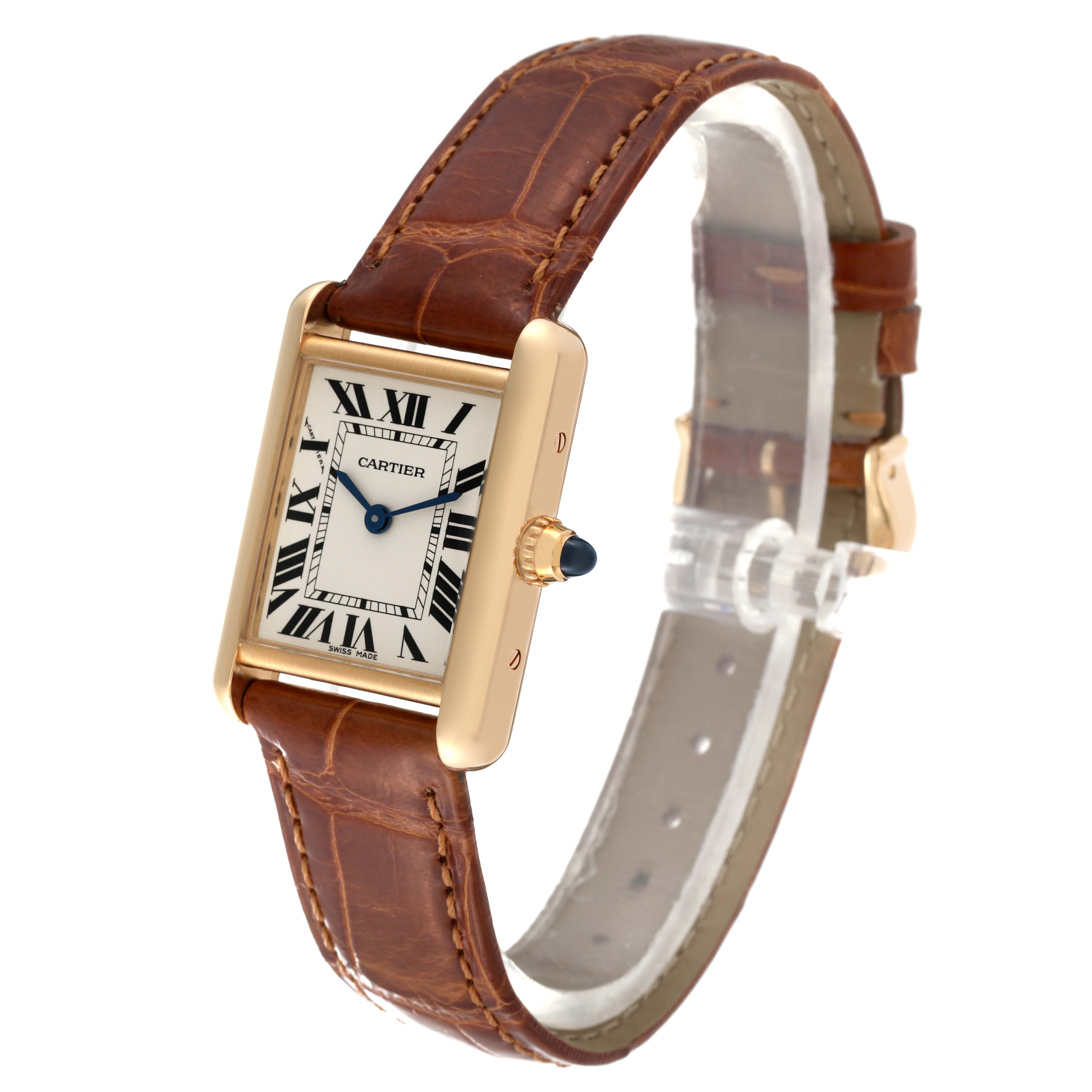 The Cartier Tank Louis W1529856 Women's Yellow Gold Silver Dial W1529856 Women's Yellow Gold Silver Dial watch is shown at a slight angle, displaying the dial, gold case, brown leather strap, and crown.