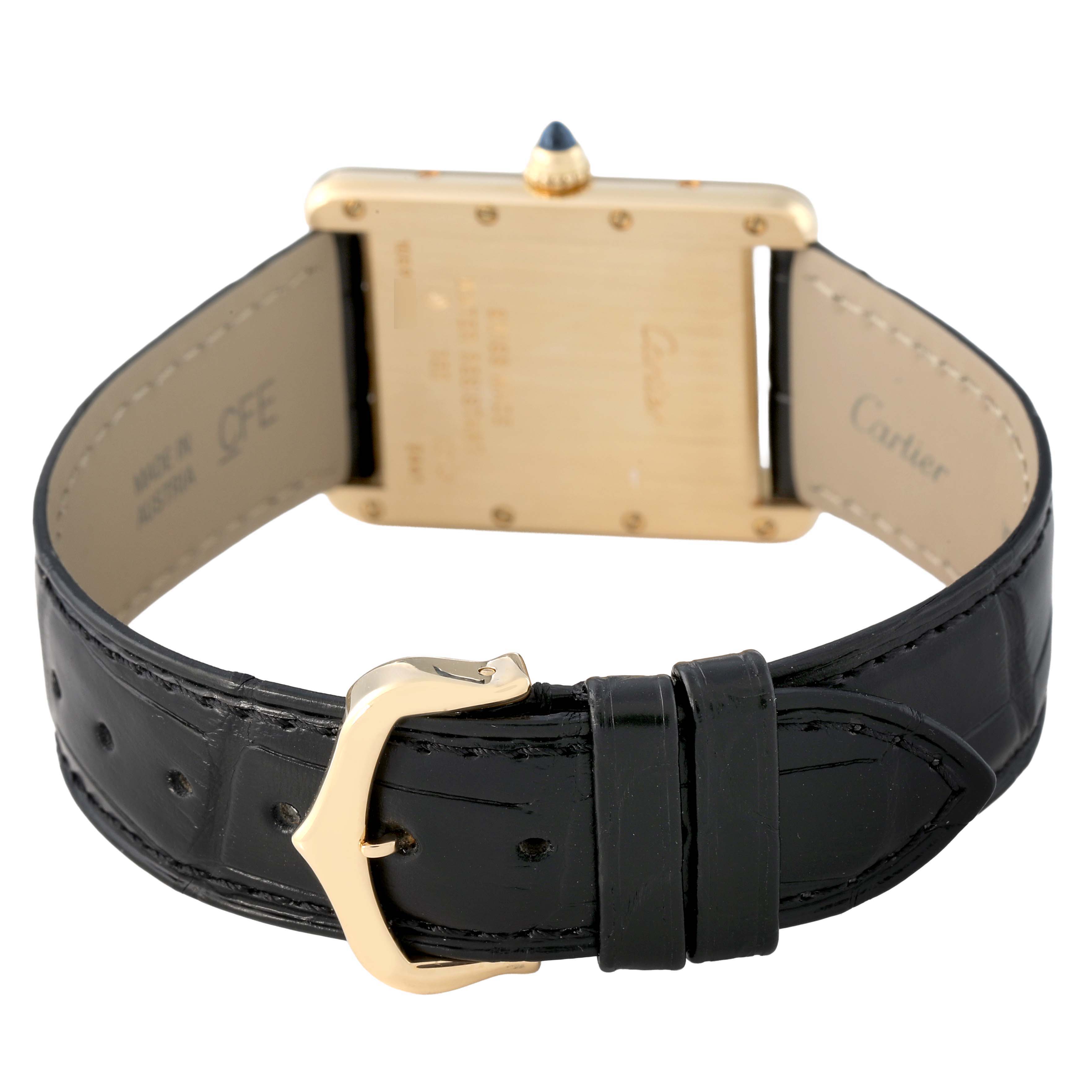 The image shows the back and clasp of the Tank Louis watch by Cartier, highlighting the leather strap and gold buckle.