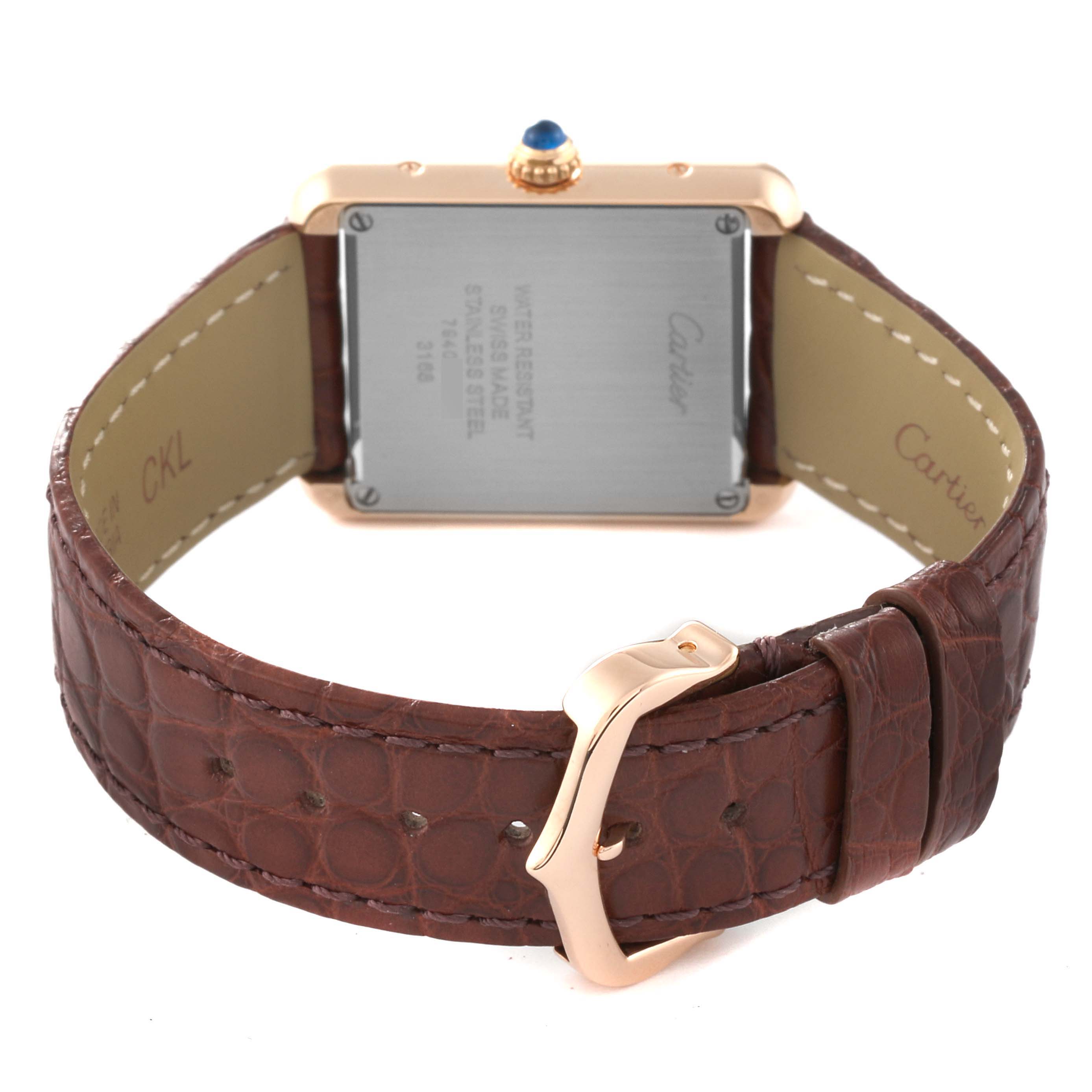 The image shows the back case and brown leather strap of a Cartier Tank Solo W5200024 Women
s Steel and Gold (two tone) Silver Dial W5200024 Women
s Steel and Gold (two tone) Silver Dial watch.