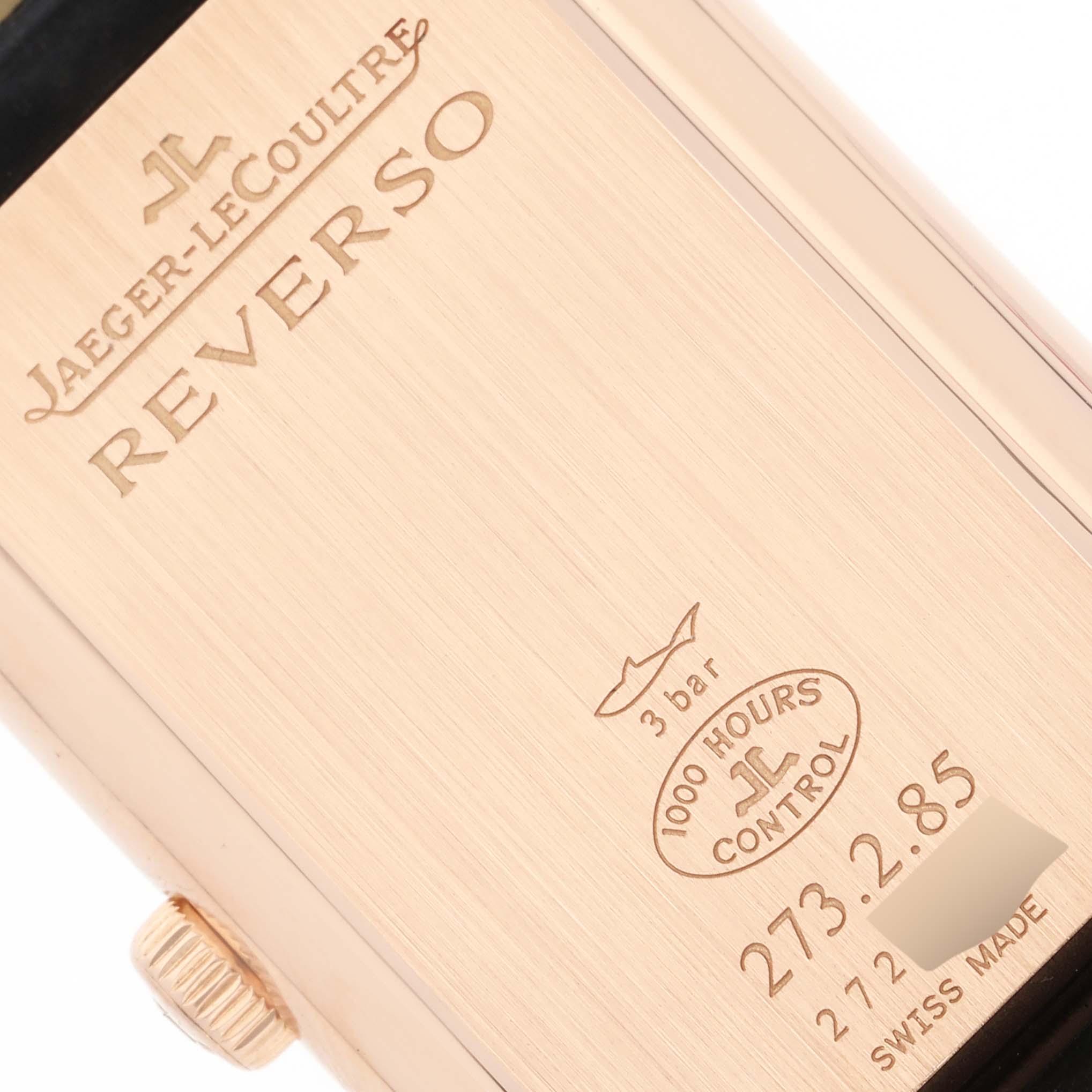 This image shows the case back of a Jaeger-LeCoultre Reverso watch at a slight angle, highlighting model and water resistance details.