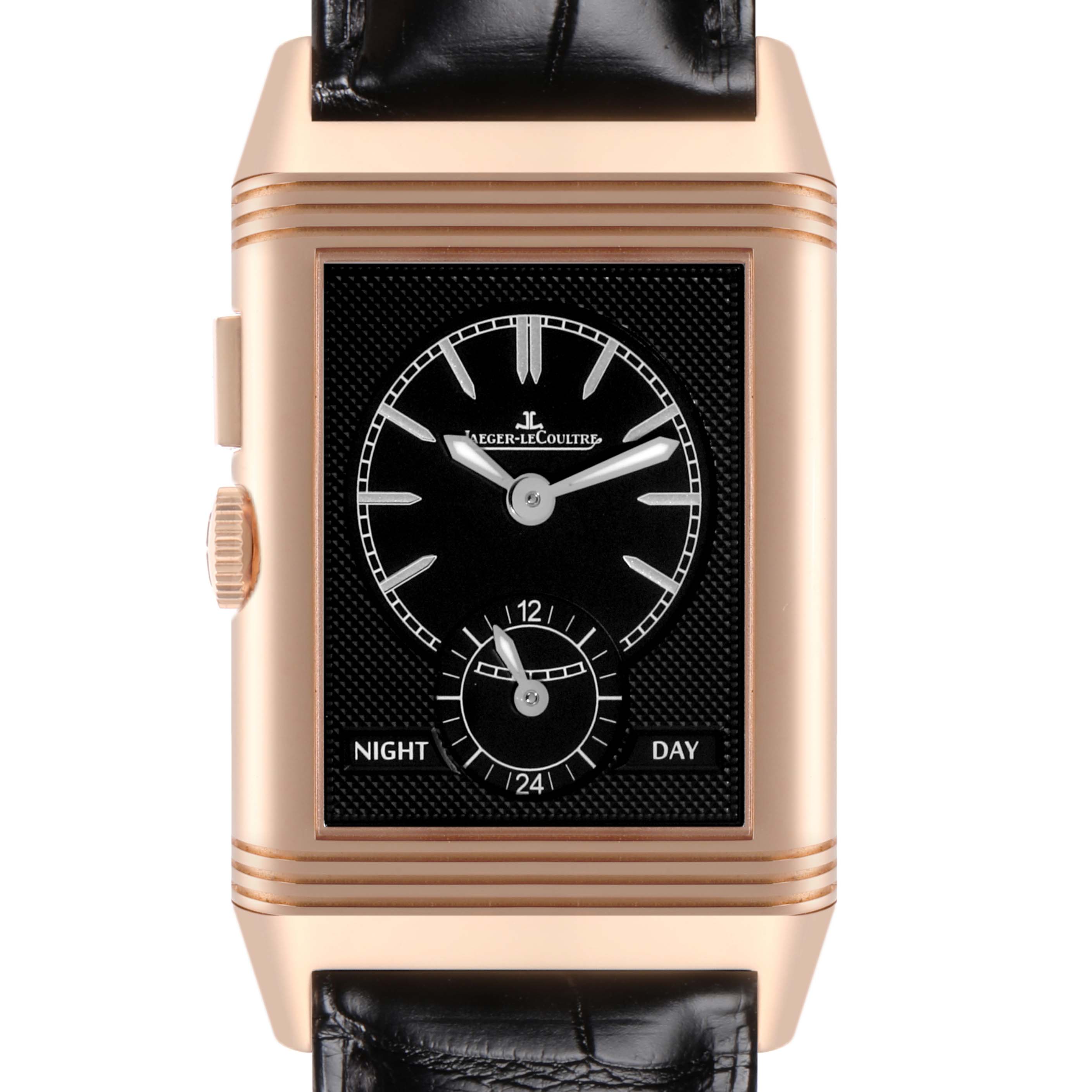 The image shows a Jaeger-LeCoultre Reverso watch front-on, showcasing its black dial, subdial, and gold case.