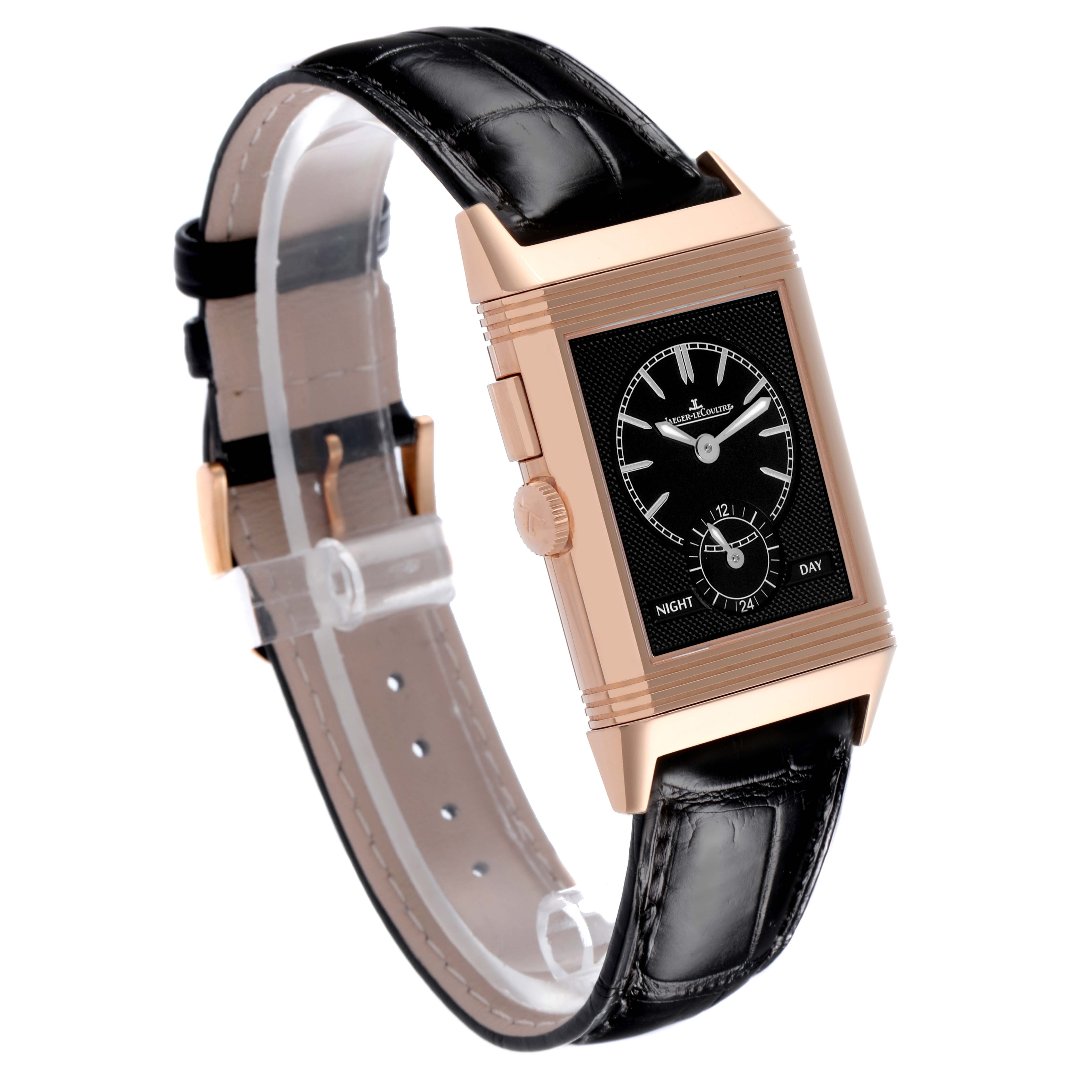 The Jaeger-LeCoultre Reverso watch is shown at a three-quarter angle, displaying its case, dial, crown, and strap.