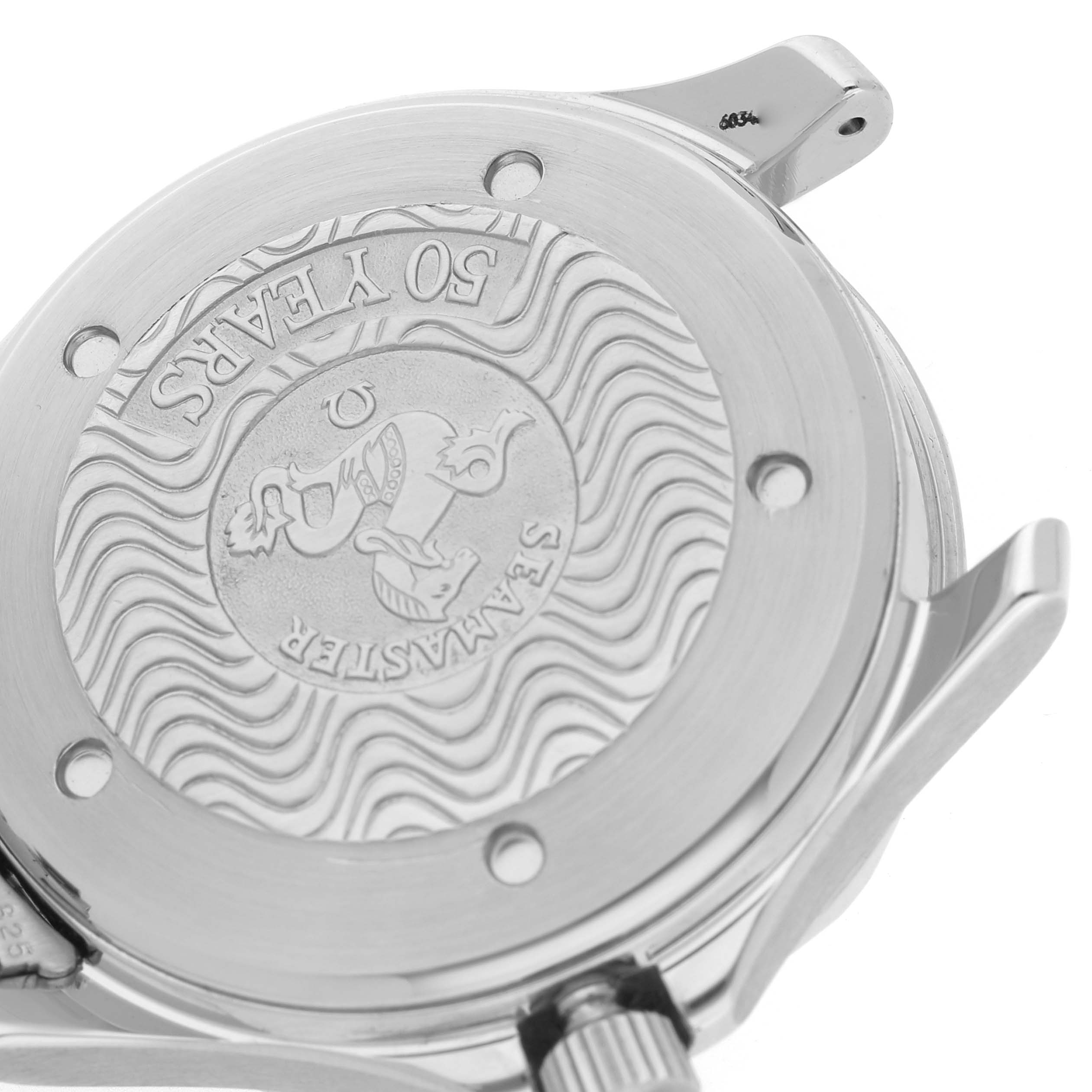 The image shows the back case of the Omega Seamaster 2534.50.00 Men's Stainless Steel Black Dial watch at an angle, featuring engravings and wave patterns.