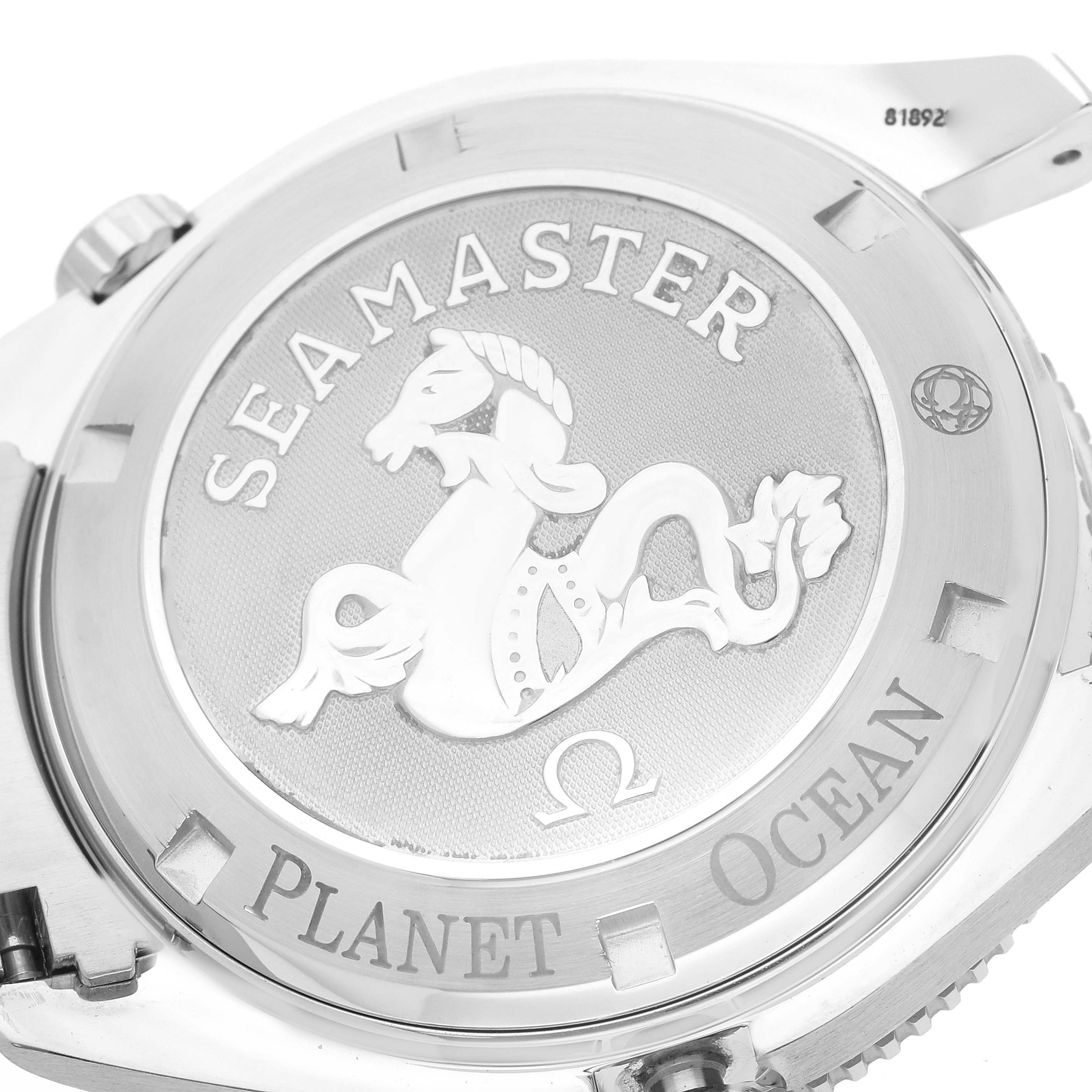 This image shows the back case of the Omega Seamaster Planet Ocean watch, highlighting the engraved logo and model name.