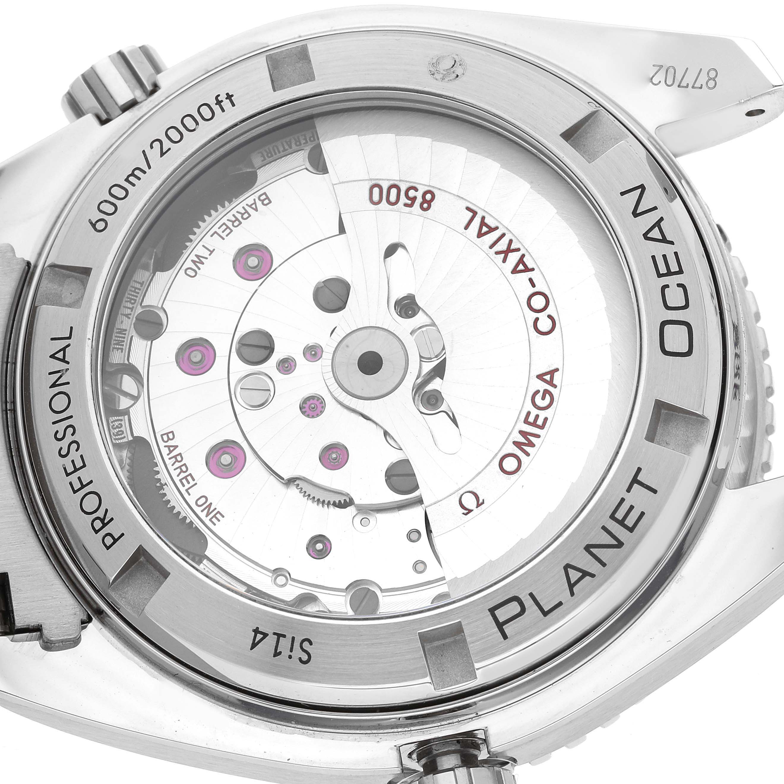 The image shows the back view of an Omega Seamaster Planet Ocean watch, highlighting its mechanical movement and specifications.