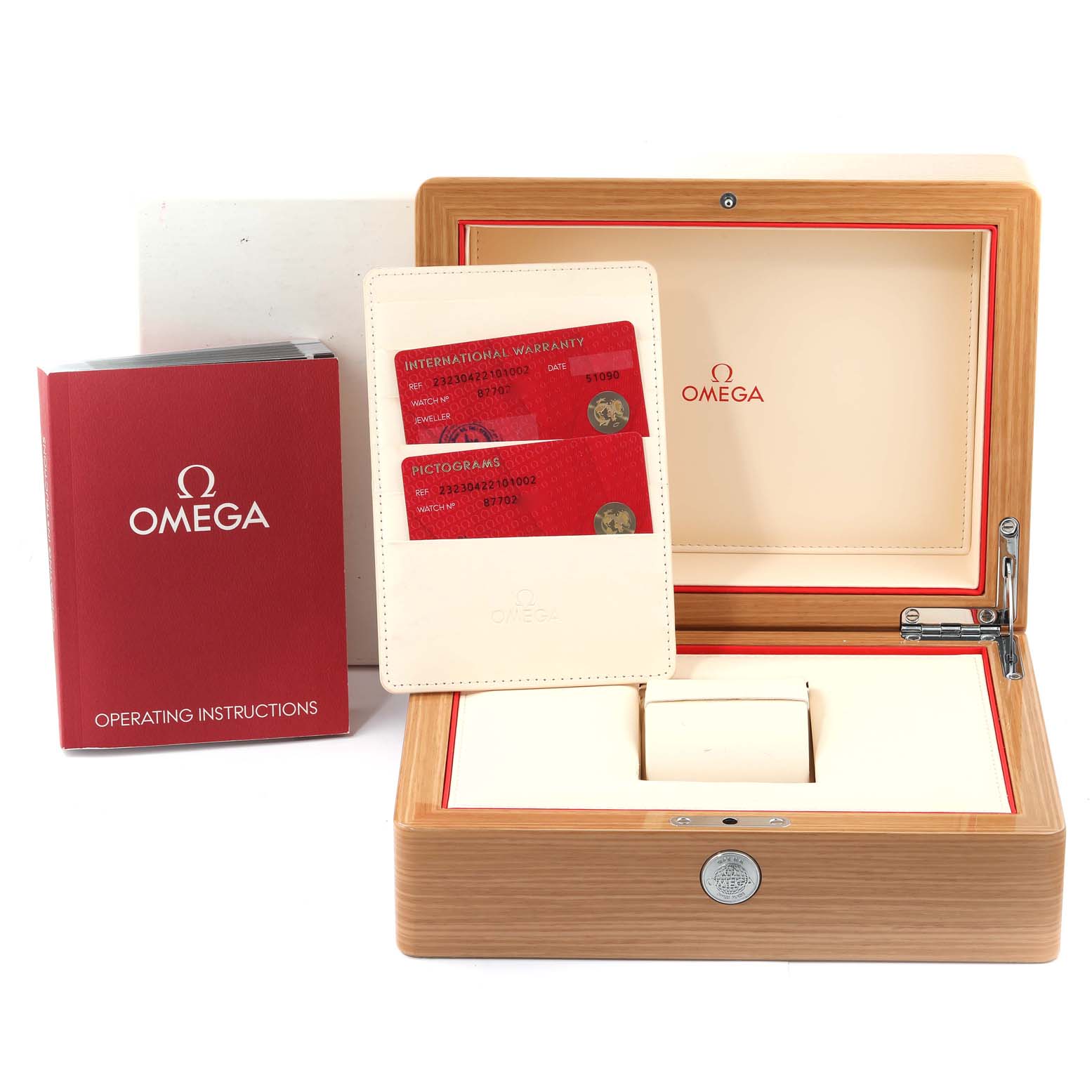 This image shows the packaging, warranty cards, and the operating instructions for the Omega Seamaster model.