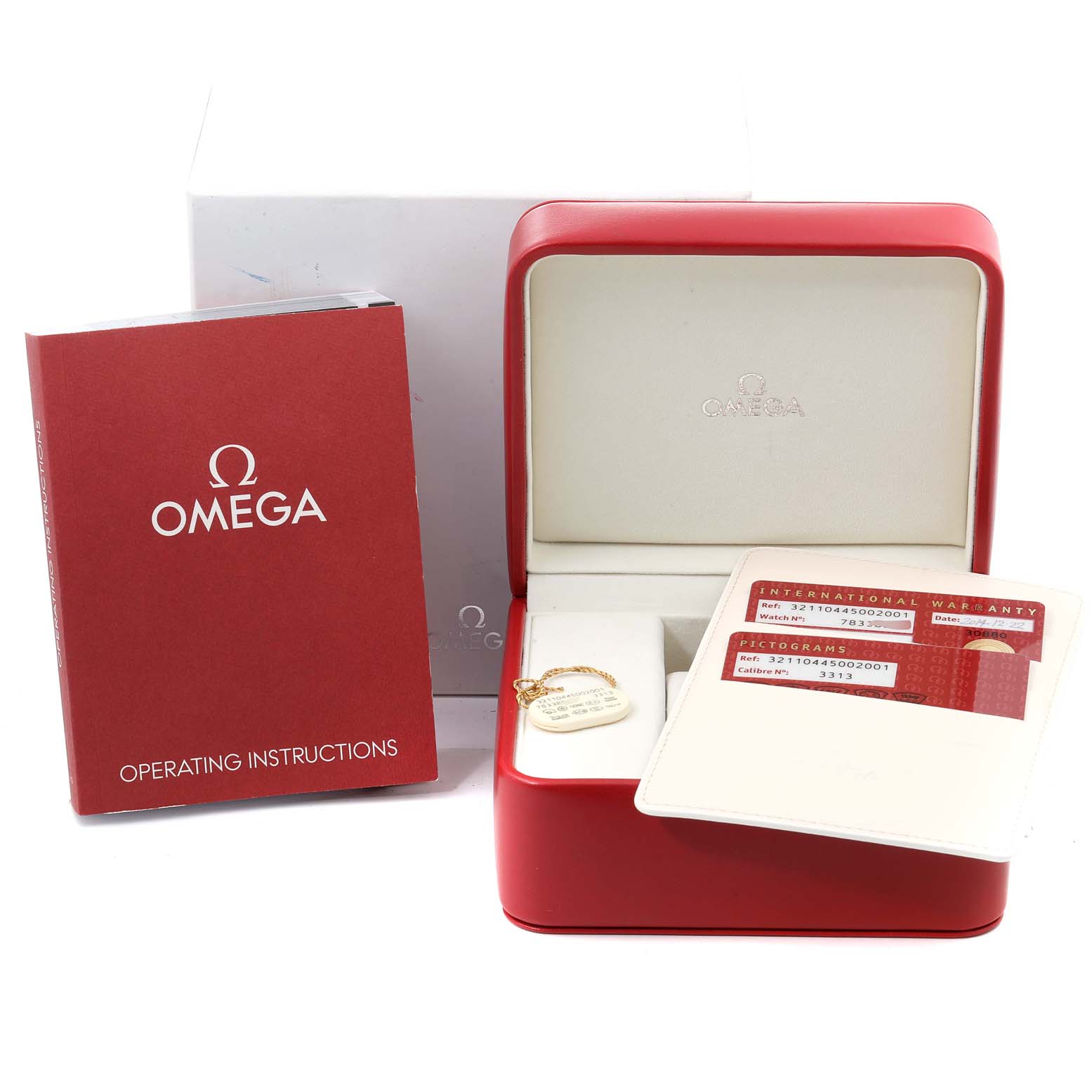 The image shows an Omega Speedmaster 321.10.44.50.02.001 Men
s Stainless Steel Silver Dial 321.10.44.50.02.001 Men
s Stainless Steel Silver Dial watch box, warranty cards, and the operating instructions manual from a front angle.