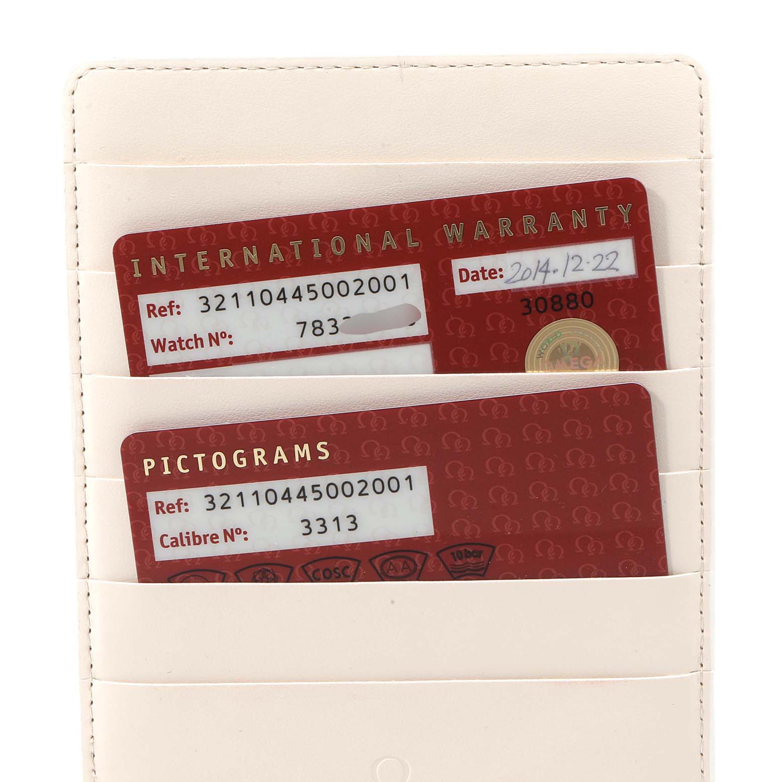 The image shows the international warranty and pictograms cards for an Omega Speedmaster 321.10.44.50.02.001 Men
s Stainless Steel Silver Dial 321.10.44.50.02.001 Men
s Stainless Steel Silver Dial watch.