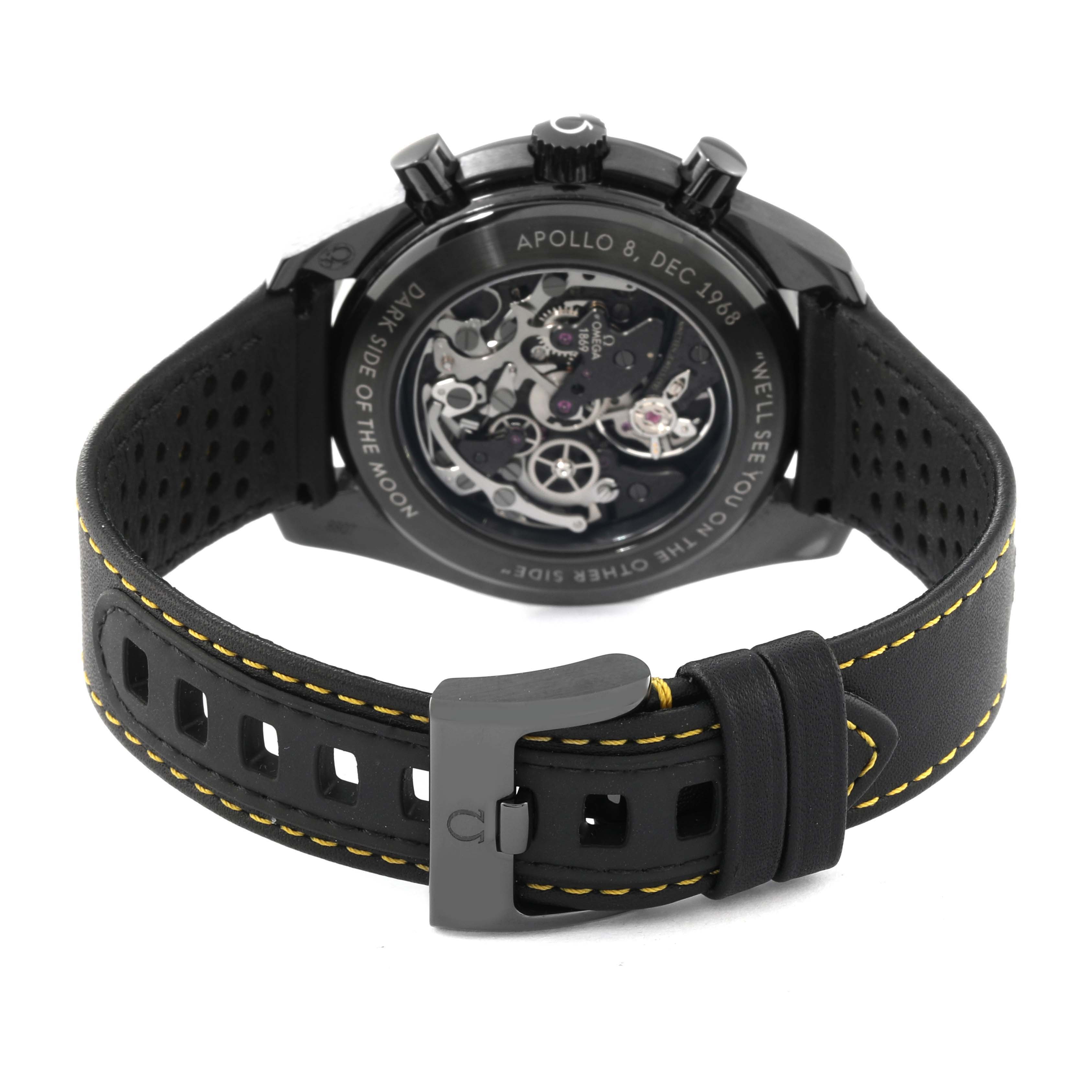 The Omega Speedmaster 311.92.44.30.01.001 Men's Ceramic Black Dial 311.92.44.30.01.001 Men's Ceramic Black Dial watch is shown from the back, displaying its inner mechanisms and black leather strap with yellow stitching.