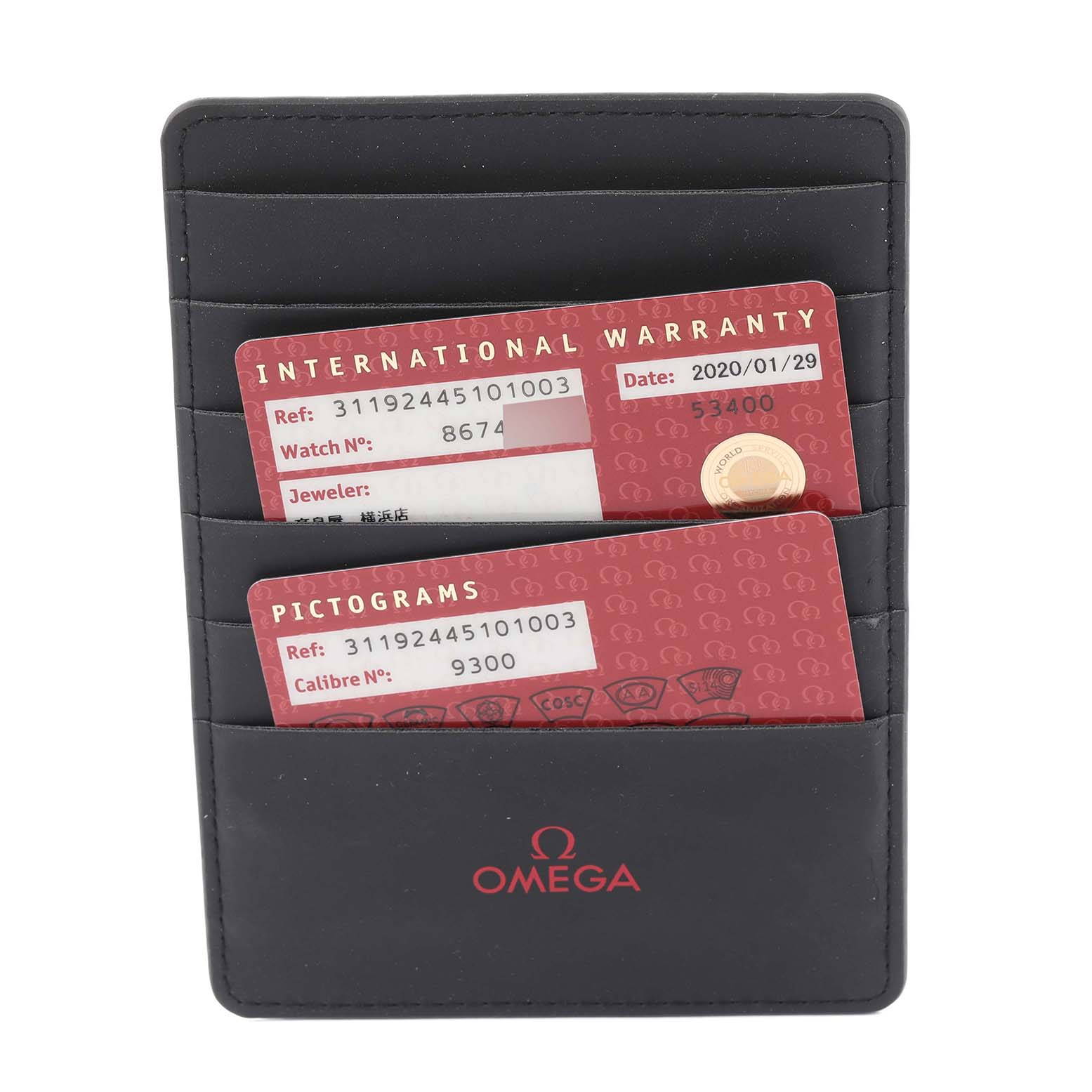 This image shows the international warranty and pictogram cards for an Omega Speedmaster 311.92.44.51.01.003 Men
s Ceramic Black Dial 311.92.44.51.01.003 Men
s Ceramic Black Dial watch in a cardholder.