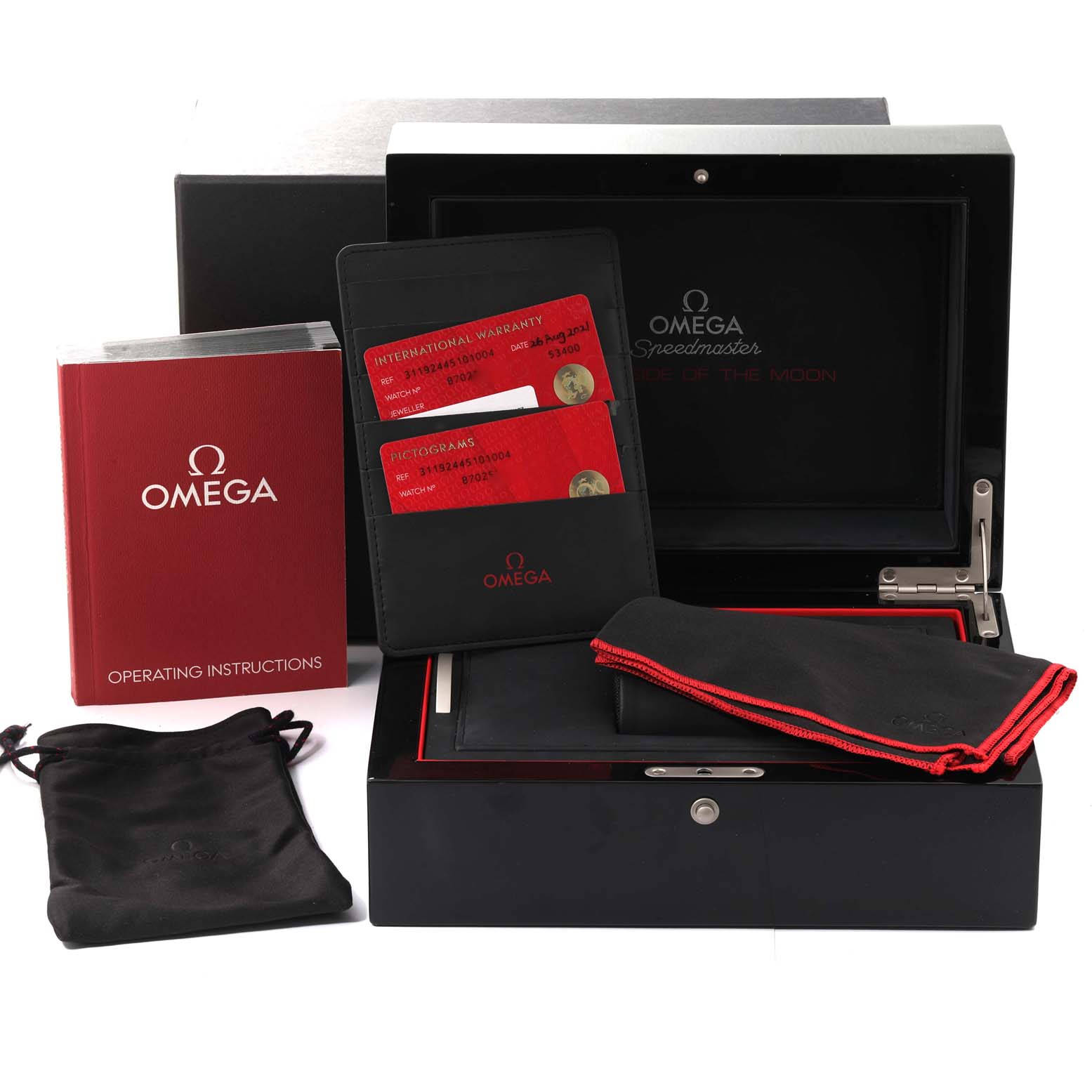 The image shows the packaging, operating instructions, warranty cards, and accessories for an Omega Speedmaster 311.92.44.51.01.004 Men's Ceramic Black Dial 311.92.44.51.01.004 Men's Ceramic Black Dial watch.