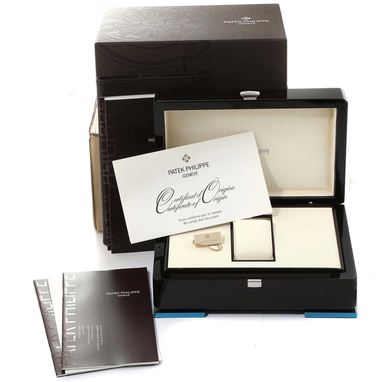 The image shows the packaging, certificate, and accessories for a Patek Philippe Complications 4936G - 001 Men's White Gold Mother of Pearl Dial 4936G - 001 Men's White Gold Mother of Pearl Dial model watch.