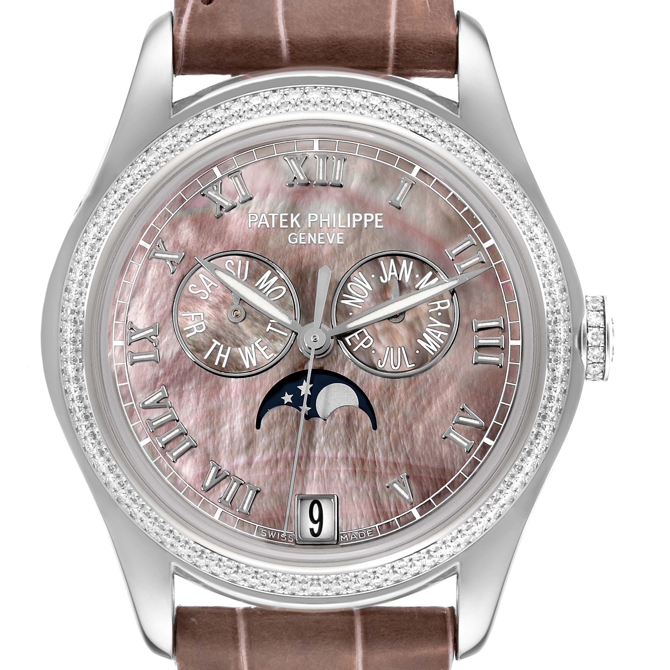 The image shows a front angle of the Patek Philippe Complications 4936G - 001 Men's White Gold Mother of Pearl Dial 4936G - 001 Men's White Gold Mother of Pearl Dial watch, highlighting its face, dials, and a section of the strap.