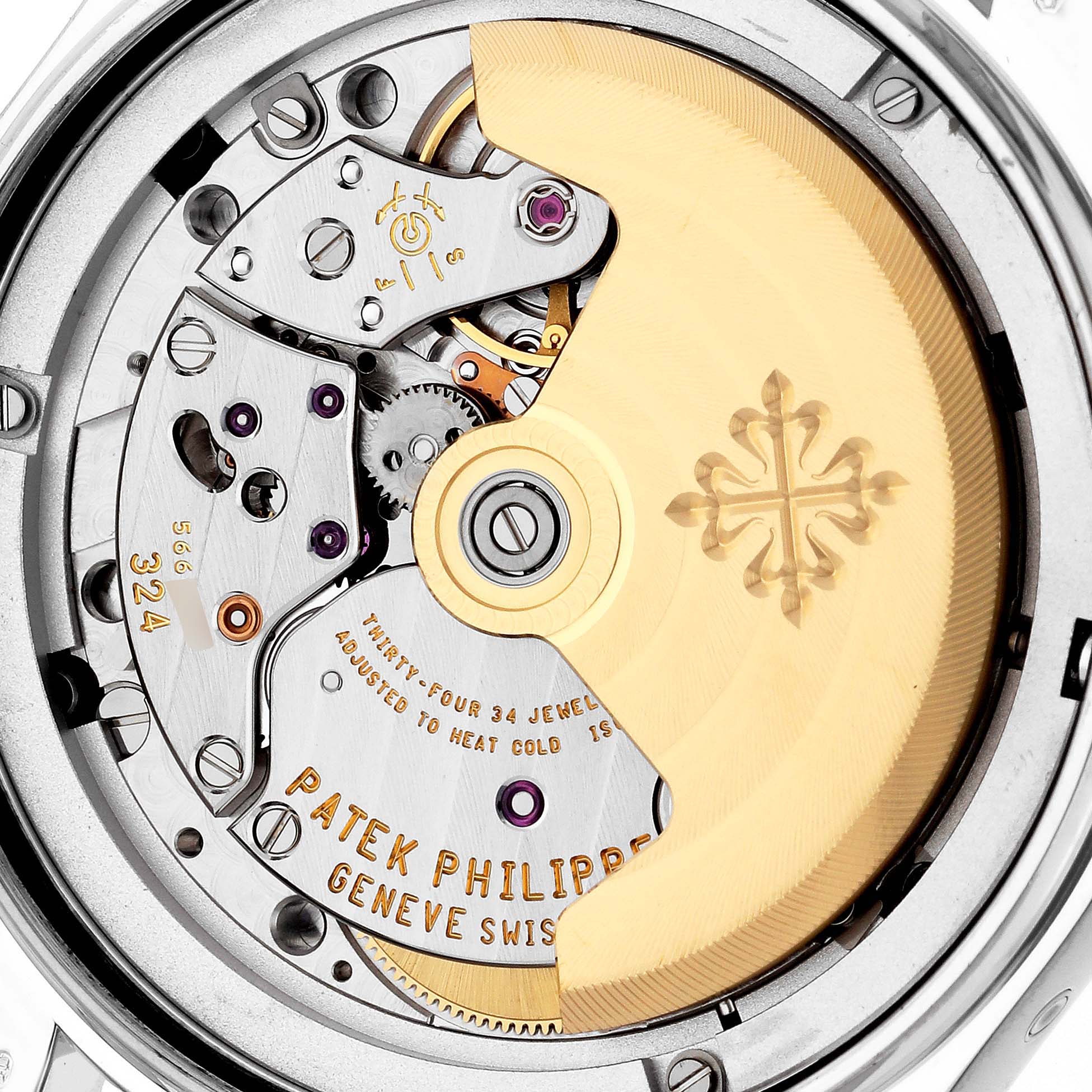 This image shows the open caseback of a Patek Philippe Complications 4936G - 001 Men's White Gold Mother of Pearl Dial 4936G - 001 Men's White Gold Mother of Pearl Dial model, showcasing the movement parts and rotor.