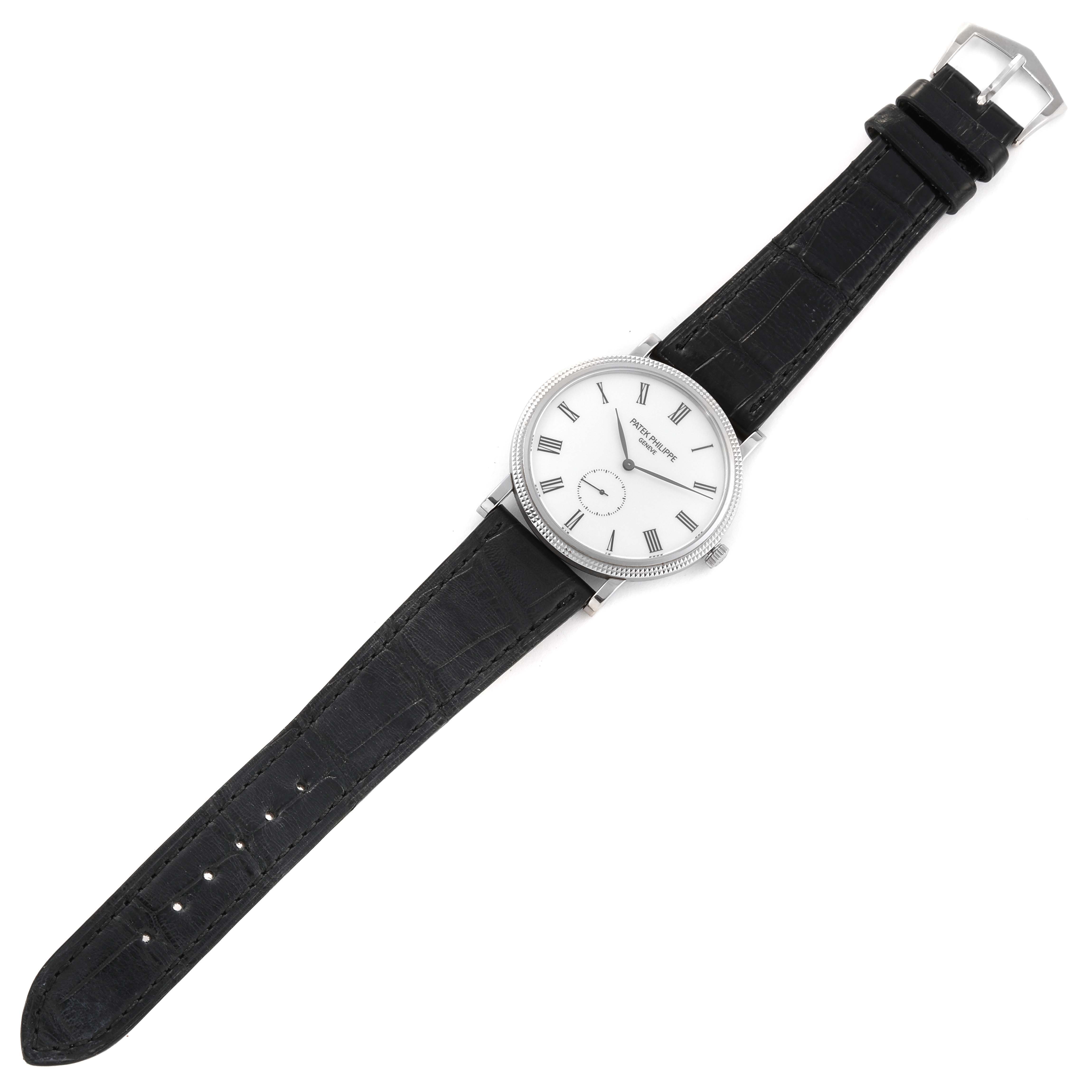 The image shows a Patek Philippe Calatrava 5119G-001 Men's White Gold White Dial 5119G-001 Men's White Gold White Dial watch from a top-down angle, displaying the face, bezel, strap, and buckle.