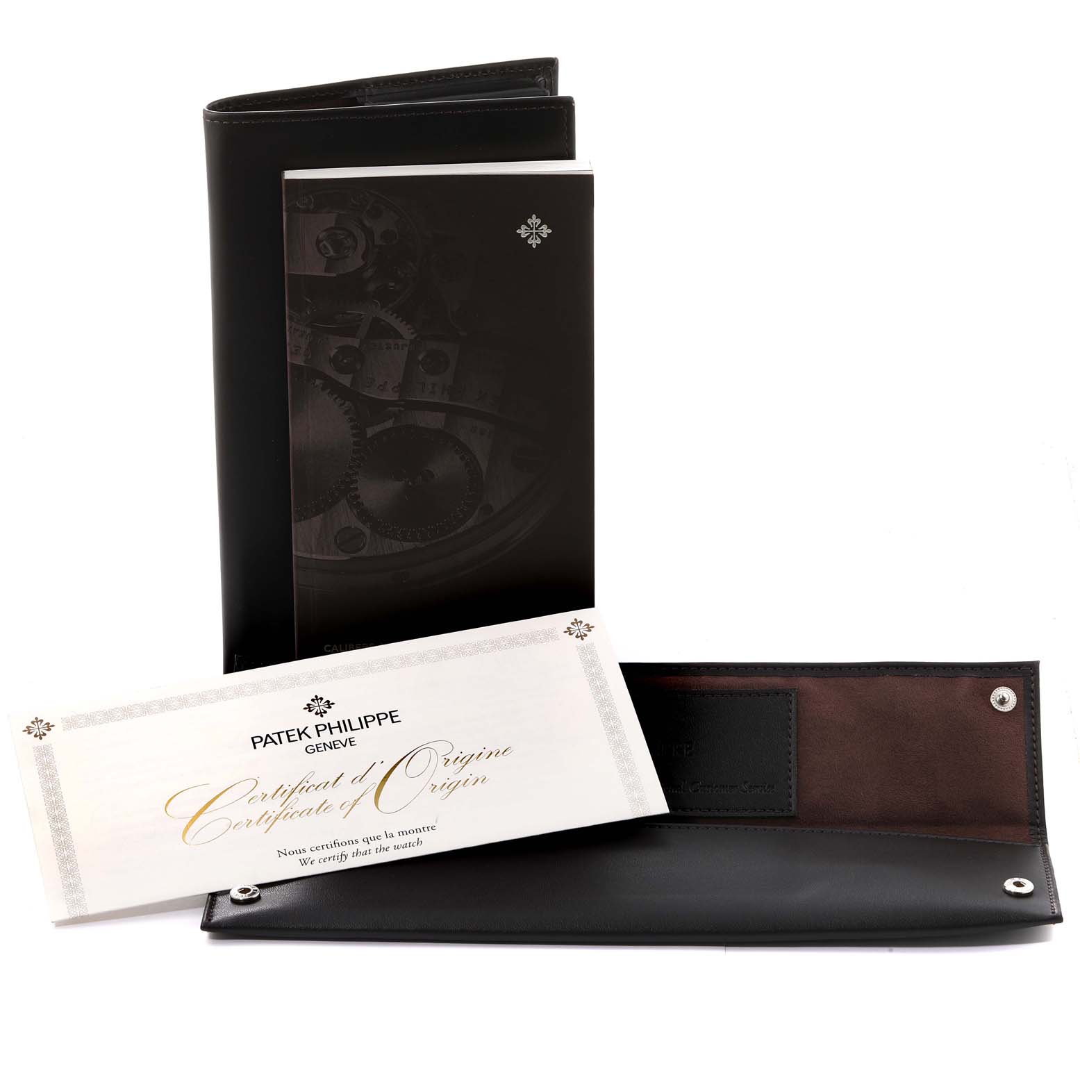 This image shows the Patek Philippe Calatrava 5119G-001 Men's White Gold White Dial 5119G-001 Men's White Gold White Dial watch's certificate of origin, a booklet, and a leather case.