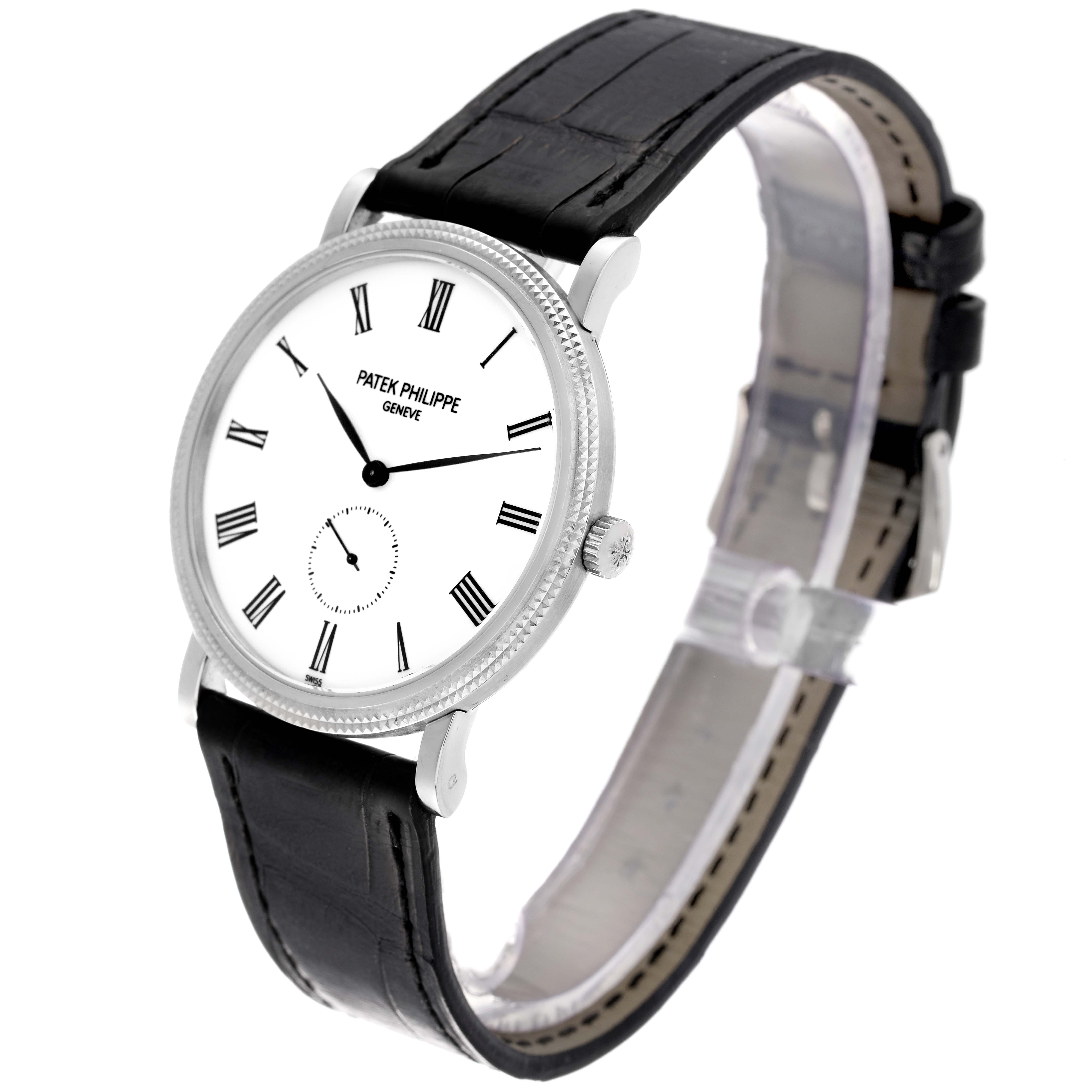 The image shows a Patek Philippe Calatrava 5119G-001 Men's White Gold White Dial 5119G-001 Men's White Gold White Dial watch at an angle displaying its face, strap, and side crown.