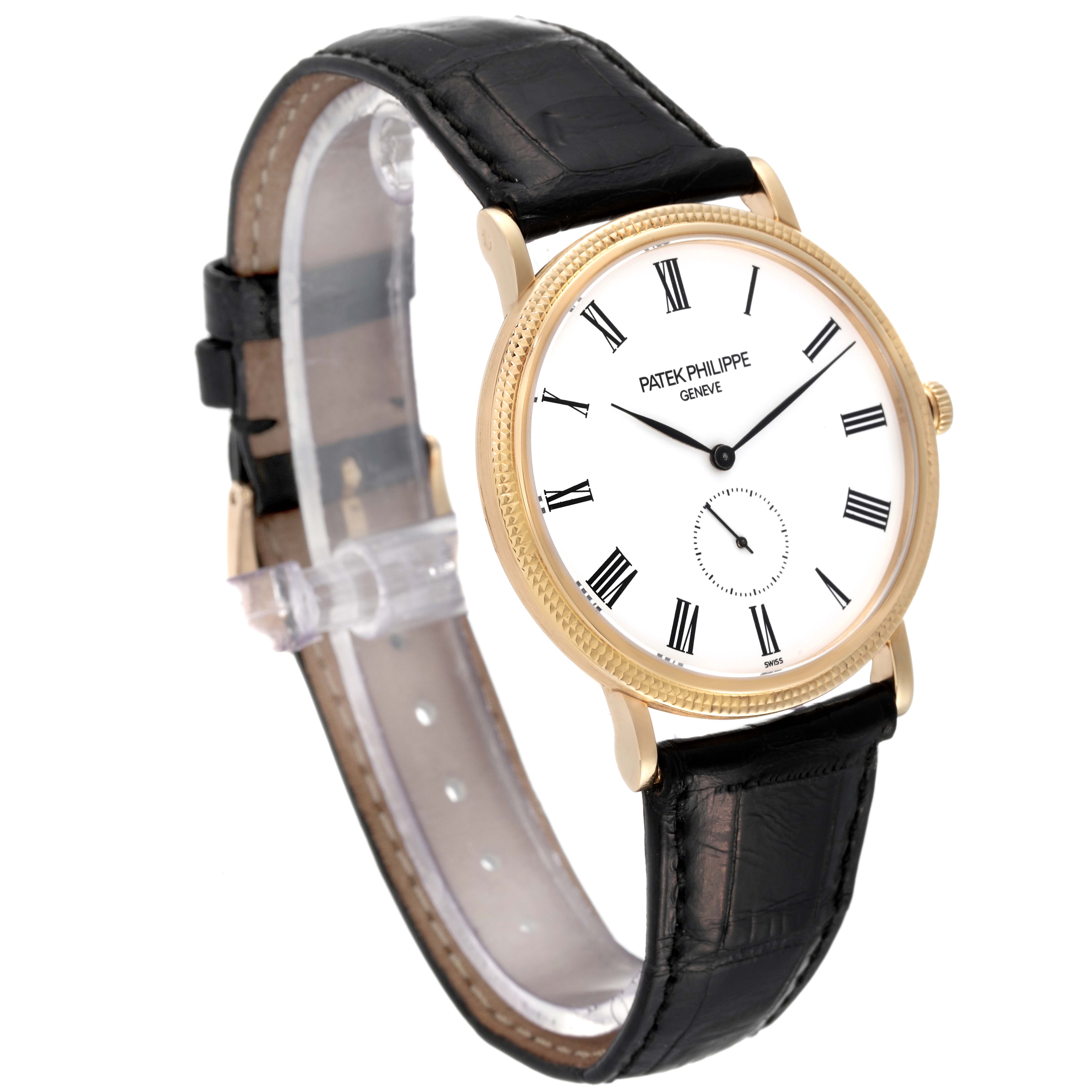 This image shows a Patek Philippe Calatrava 5119J Men's Yellow Gold White Dial 5119J Men's Yellow Gold White Dial watch from a three-quarter angle, highlighting the face, bezel, and black leather strap.