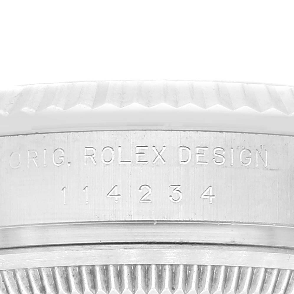 The image shows a close-up, angled view of the engraving and bezel of a Rolex Air-King 114234 Men's Stainless Steel Silver Dial 114234 Men's Stainless Steel Silver Dial watch.