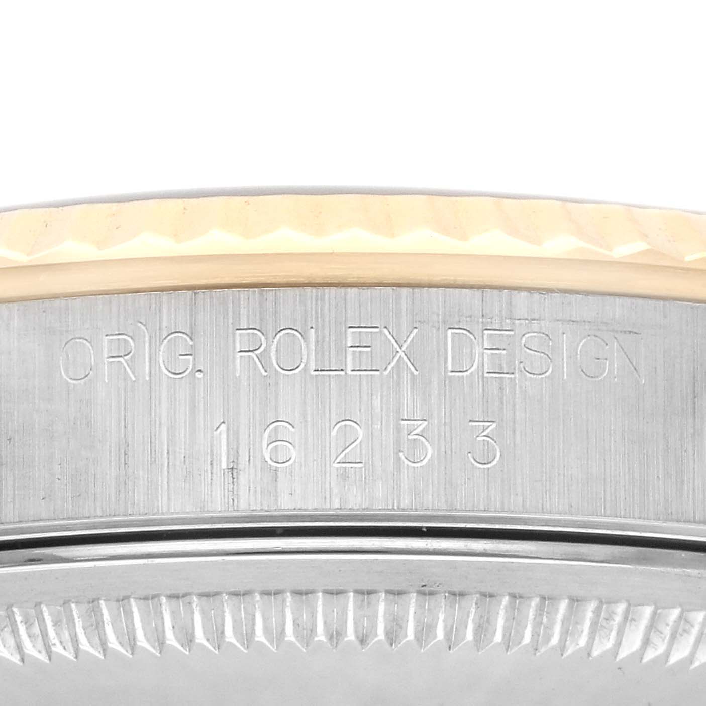The image shows the side of the Rolex Datejust 16233 Men's Steel and Gold (two tone) Champagne Dial 16233 Men's Steel and Gold (two tone) Champagne Dial case, featuring the model number and design engraving.