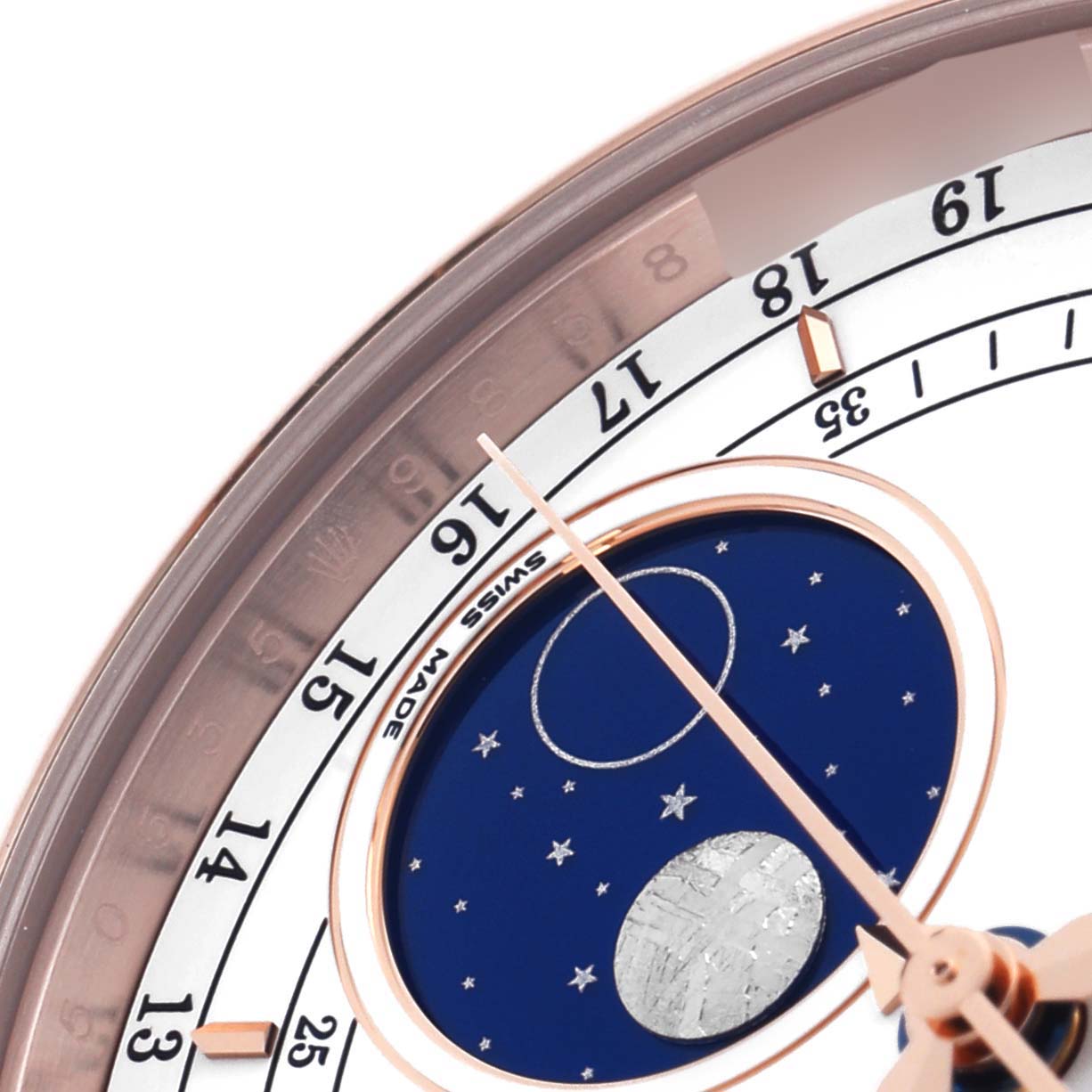 The Rolex Cellini 50535 Men's Rose Gold White Dial 50535 Men's Rose Gold White Dial watch is shown at an angle focusing on the moon phase dial, showing numbers and the "Swiss Made" label.