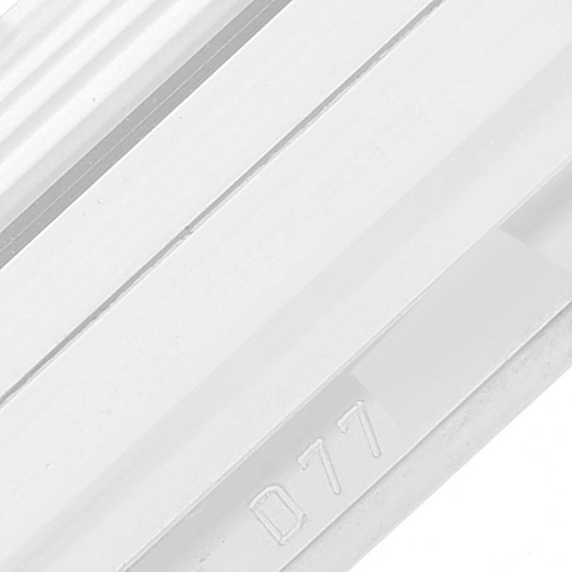 The image shows a close-up of the strap or bracelet part of a Rolex Cellini 5443/9 Men's White Gold Black Dial 5443/9 Men's White Gold Black Dial watch, specifically highlighting the engraved code "D77."