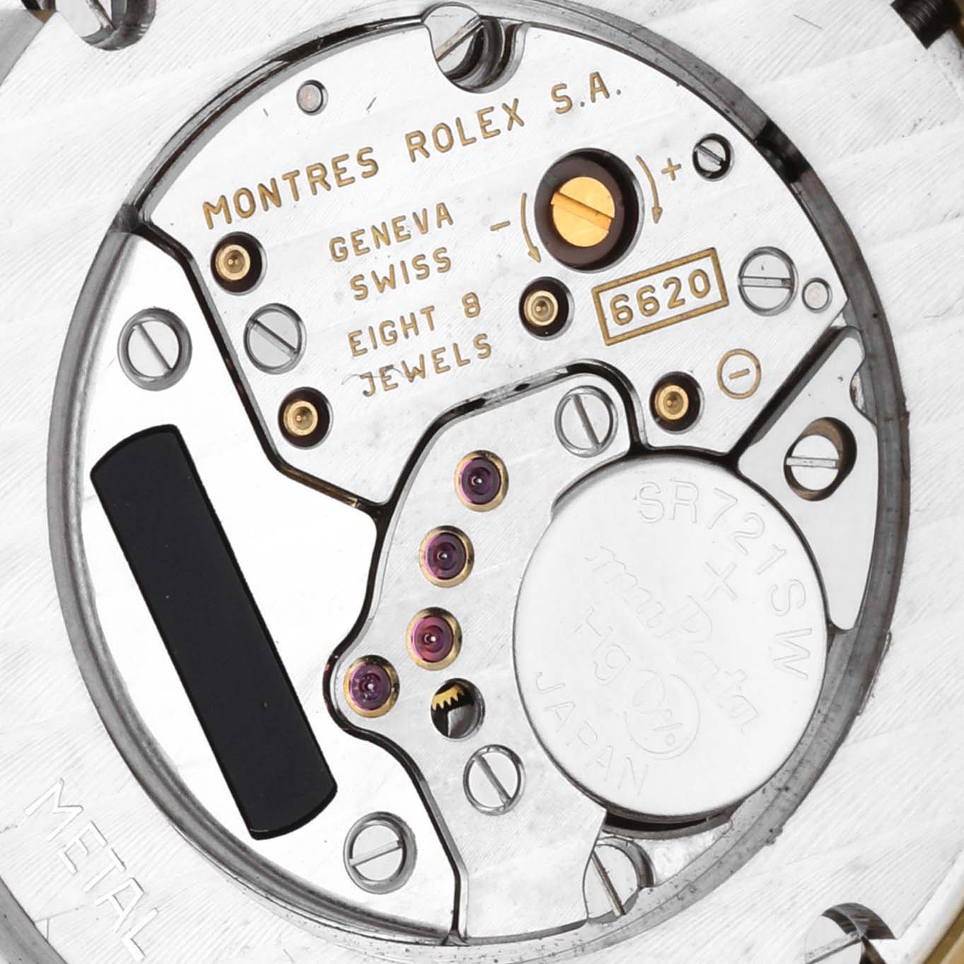 The image shows a close-up of the movement mechanism of a Rolex Cellini 6623/8 Men's Yellow Gold Champagne Dial 6623/8 Men's Yellow Gold Champagne Dial watch, highlighting components like jewels and battery.