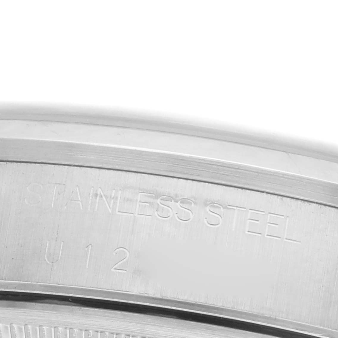 The image shows a close-up of the stainless steel case back engraving on a Rolex Date 15200 Men's Stainless Steel White Dial 15200 Men's Stainless Steel White Dial model.