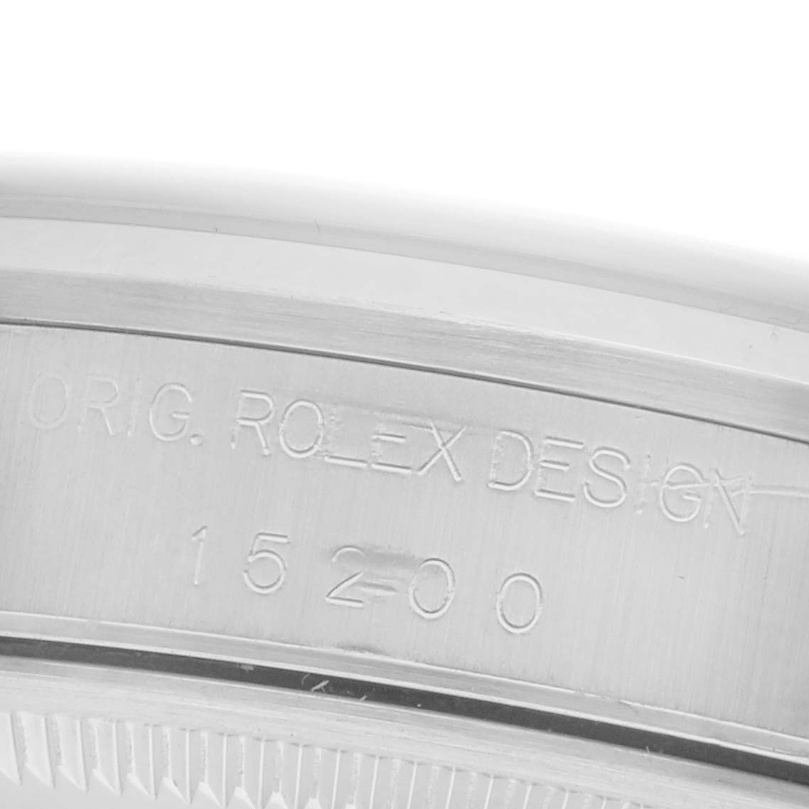 The image shows the engraved side of a Rolex Date 15200 Men's Stainless Steel White Dial 15200 Men's Stainless Steel White Dial watch, highlighting the model number and "Original Rolex Design" text.
