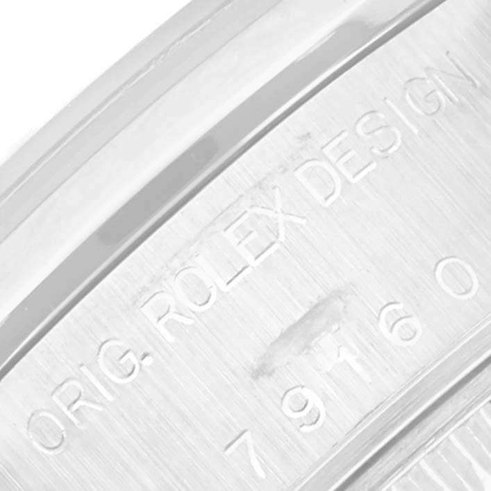 This image shows a close-up of the engraved serial number on the side of a Rolex Date 79160 Women
s Stainless Steel White Dial 79160 Women
s Stainless Steel White Dial model watch.