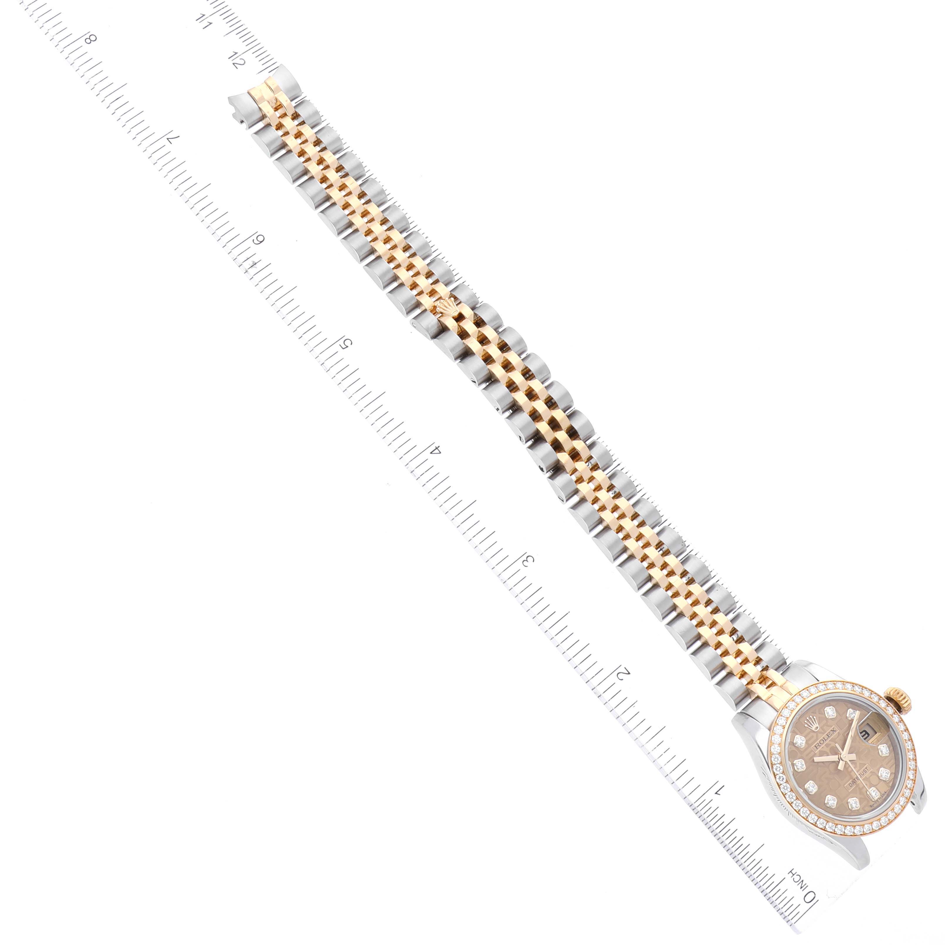 The image shows the full length of a Rolex Datejust 179383 Women's Steel and Gold (two tone) Champagne Dial 179383 Women's Steel and Gold (two tone) Champagne Dial watch laid flat with a measuring ruler alongside it.