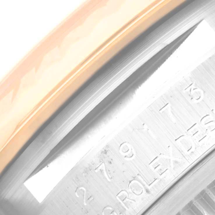 The image shows a close-up of the serial number engraving on the inner bezel of a Rolex Datejust 279173 Women's Steel and Gold (two tone) Champagne Dial 279173 Women's Steel and Gold (two tone) Champagne Dial watch.