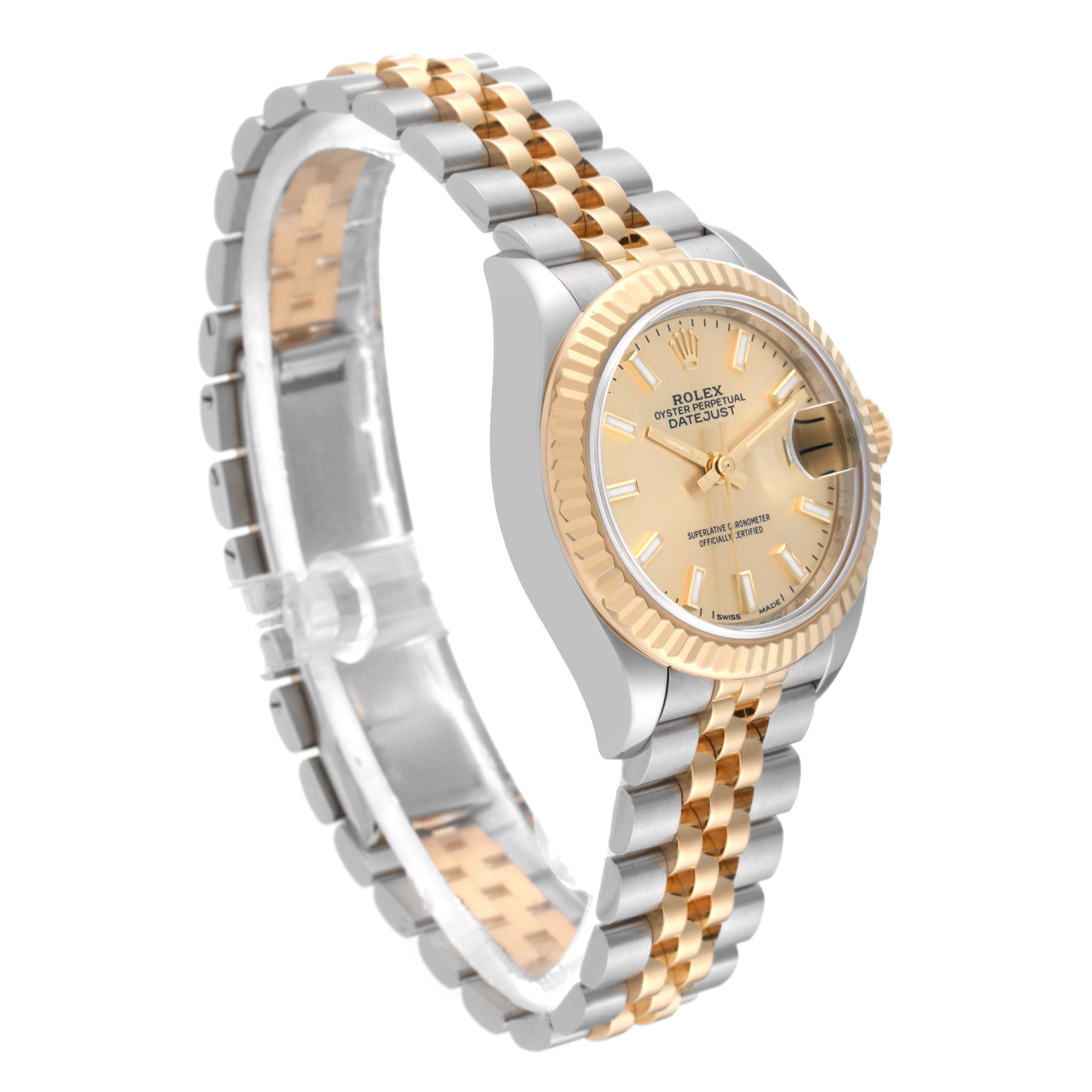 The Rolex Datejust 279173 Women's Steel and Gold (two tone) Champagne Dial 279173 Women's Steel and Gold (two tone) Champagne Dial watch is shown at a three-quarter angle, highlighting the dial, bezel, and two-tone metal bracelet.