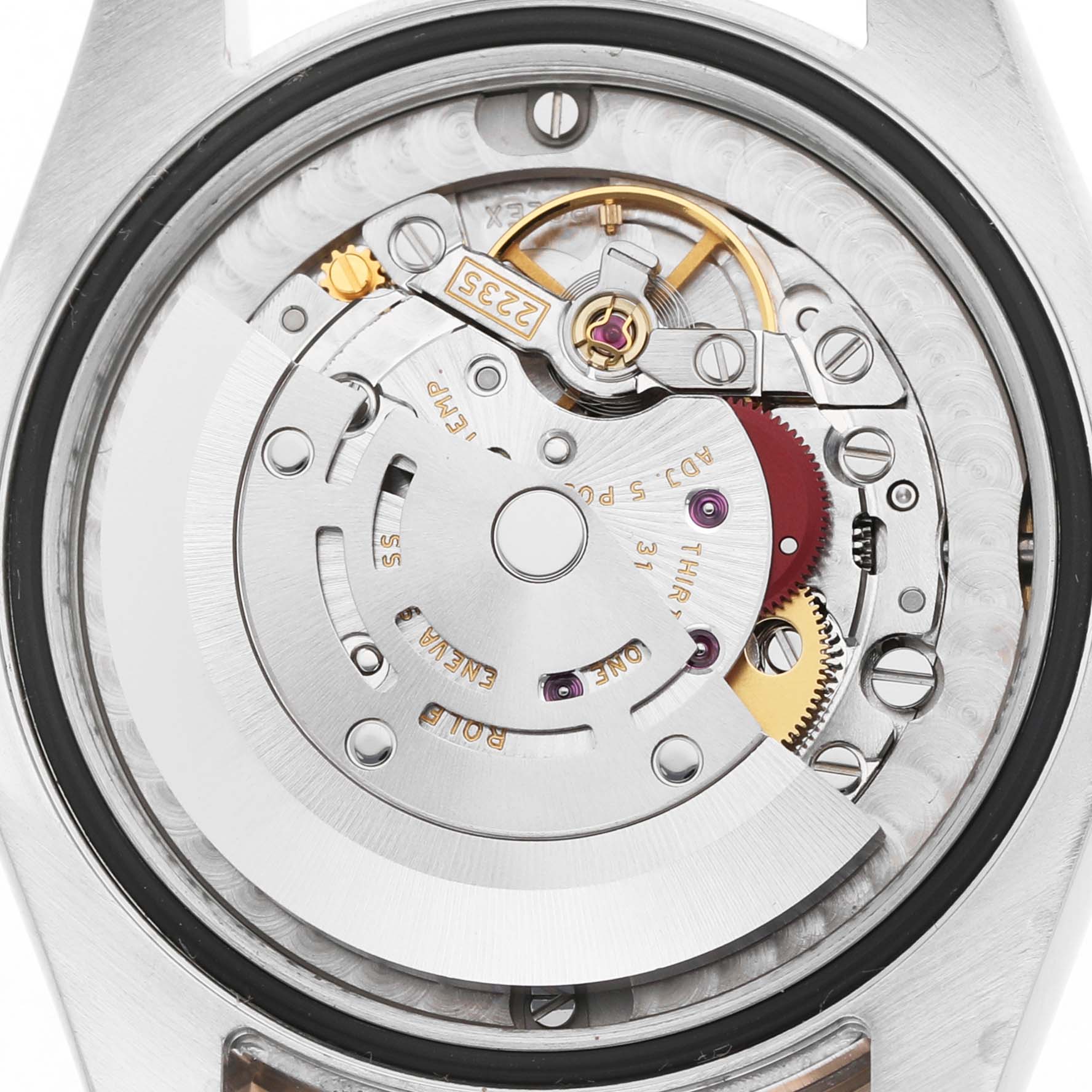 The image shows the movement mechanism of a Rolex Datejust 178341 Women's Steel and Gold (two tone) Brown Dial watch from the back angle, highlighting gears and components.