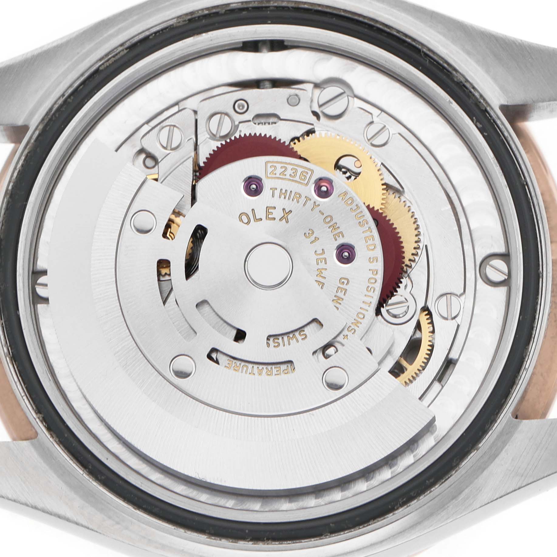 The image shows the movement mechanism of a Rolex Datejust 278341 Women's Steel and Gold (two tone) Brown Dial watch, viewed from the back with visible gears and components.