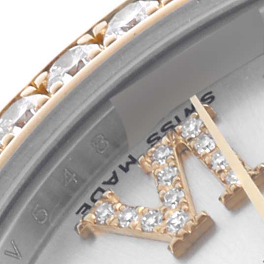 The image shows a close-up of the Rolex Datejust watch dial, showcasing a diamond-set numeral and part of the bejeweled bezel.