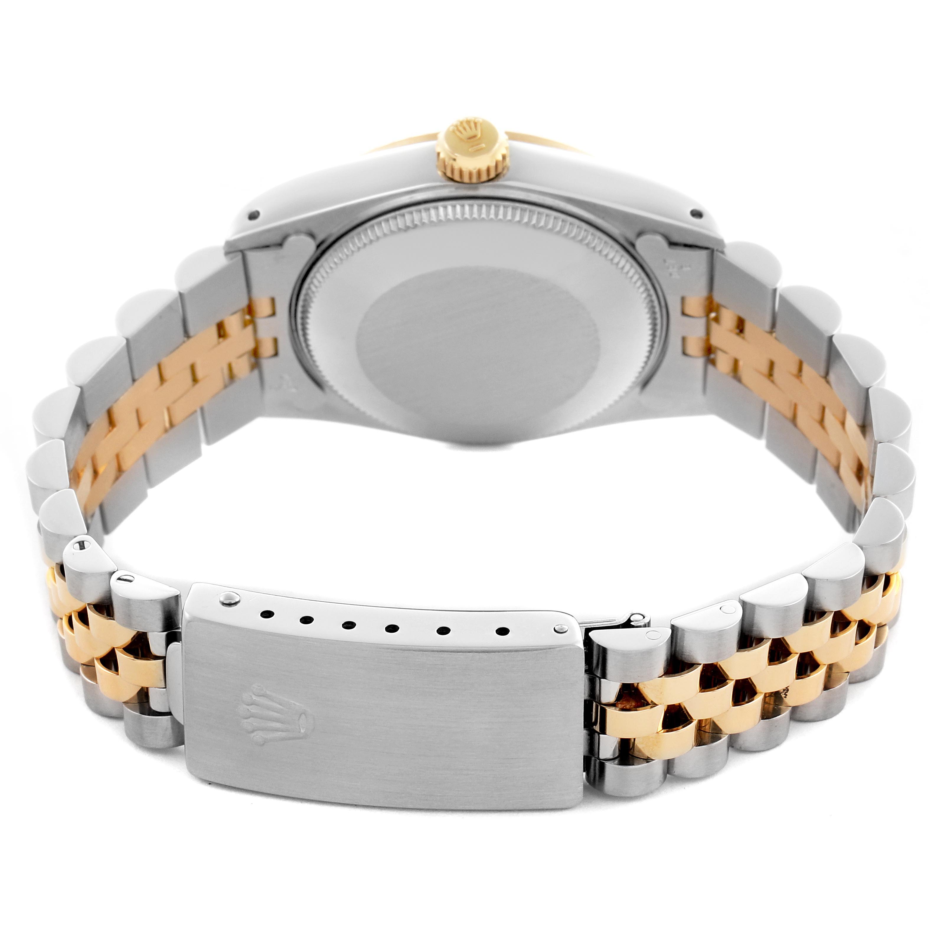 The Rolex Mid-Size 68273 Women's Steel and Gold (two tone) Champagne Dial 68273 Women's Steel and Gold (two tone) Champagne Dial model is shown from the back, highlighting the case back, crown, and two-tone bracelet with clasp.